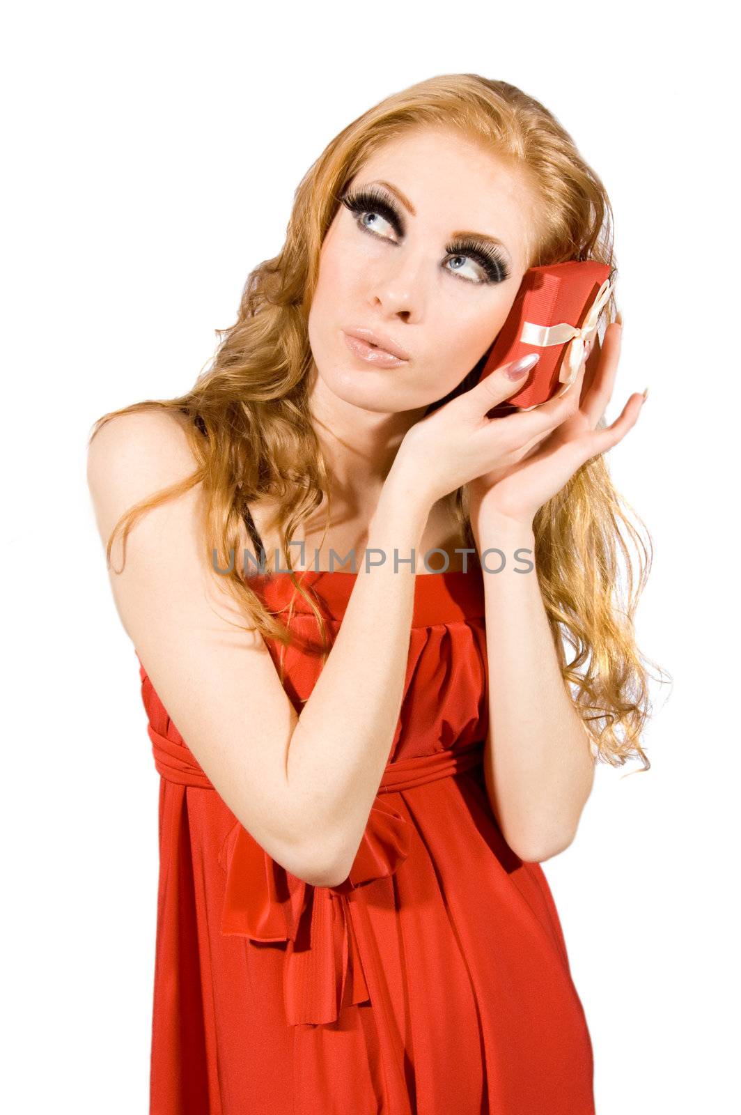 Woman in red dress holding gift-box on white