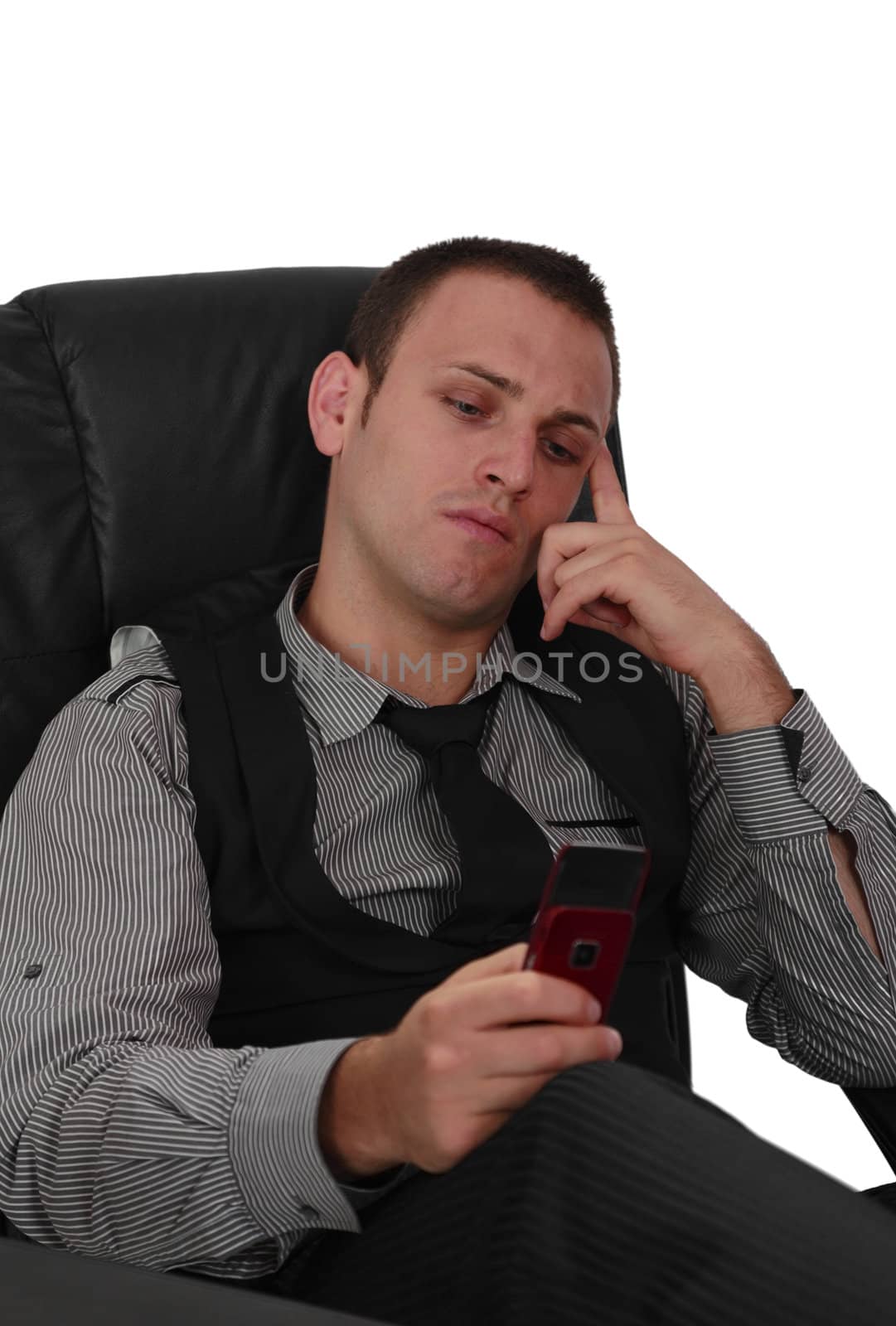 Young man checking his mobile phone, isolated against a white background.