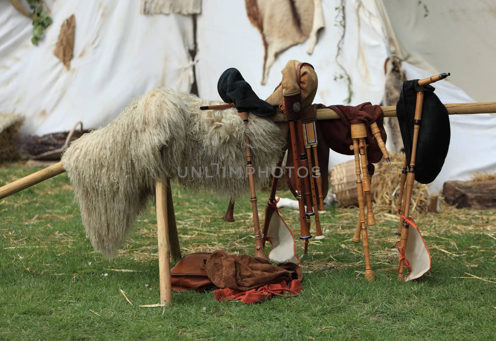 Various types of bigpipes on a stand in front of a tent during a medieval festival in Nogent le Rotrou,France.
