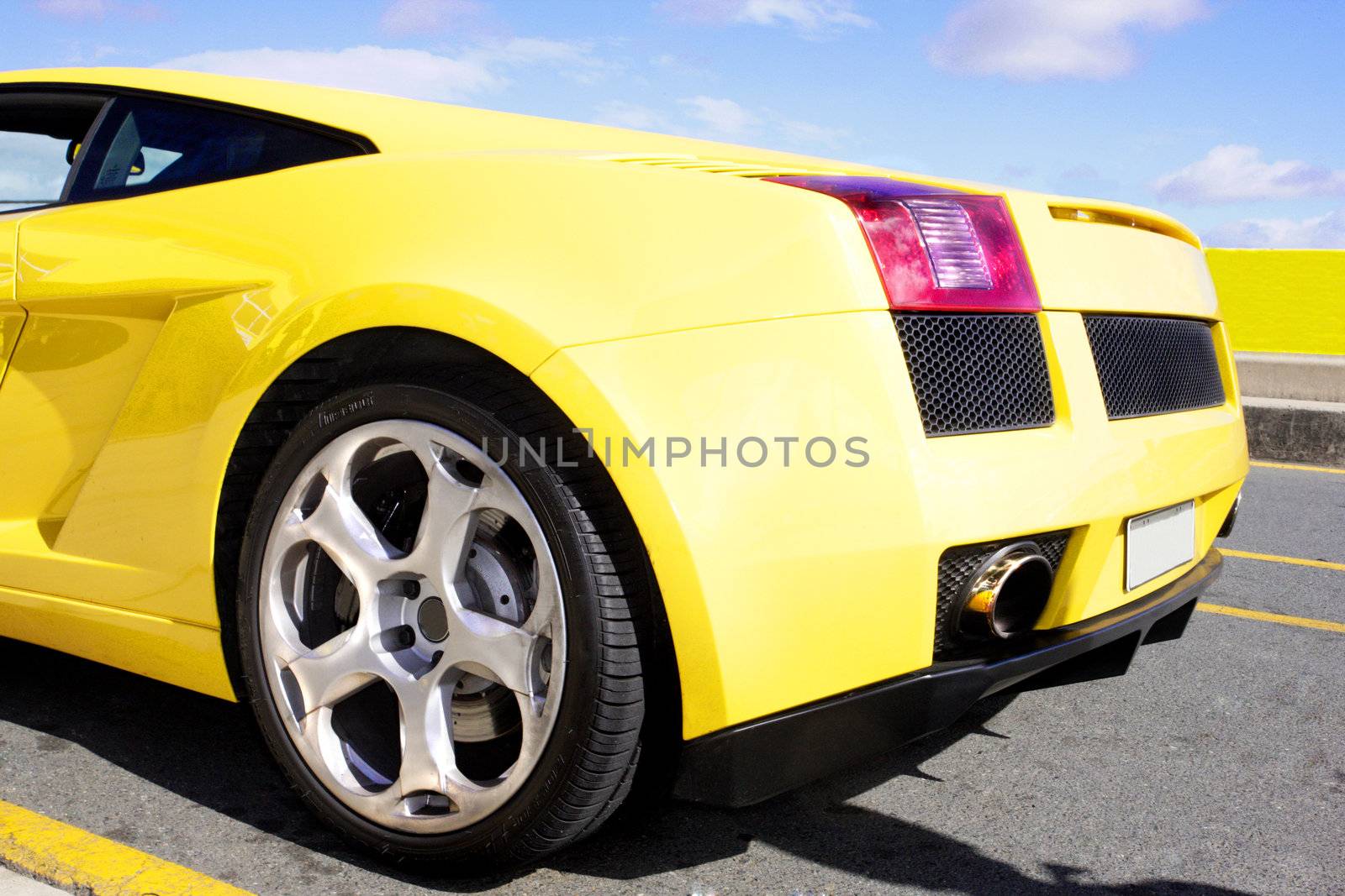 Rear view of yellow sports car