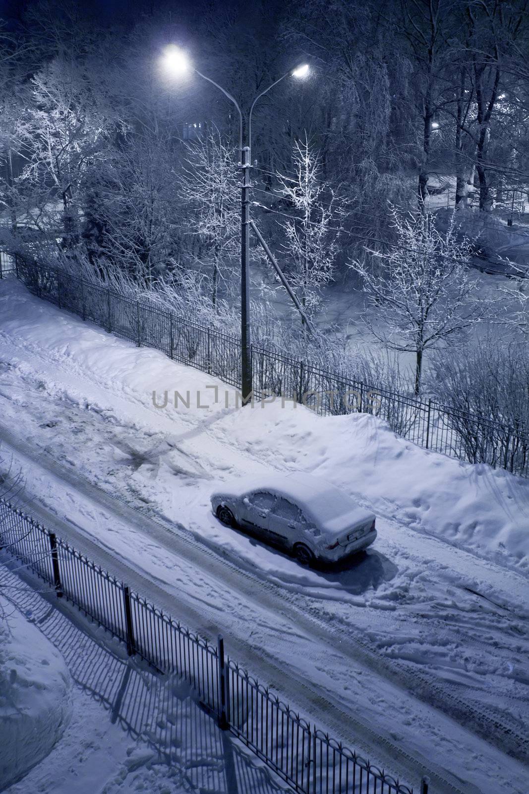 Winter evening and alone car leaved on side