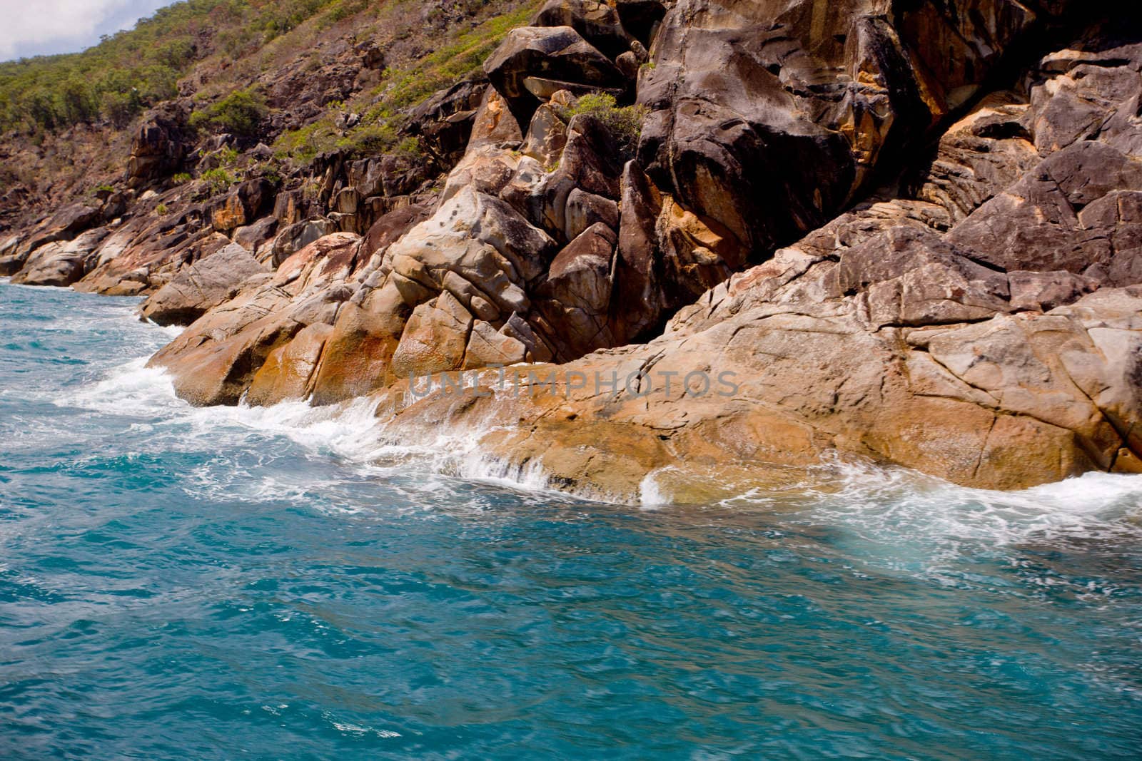 Ocean waves breaking on a mountainside. 