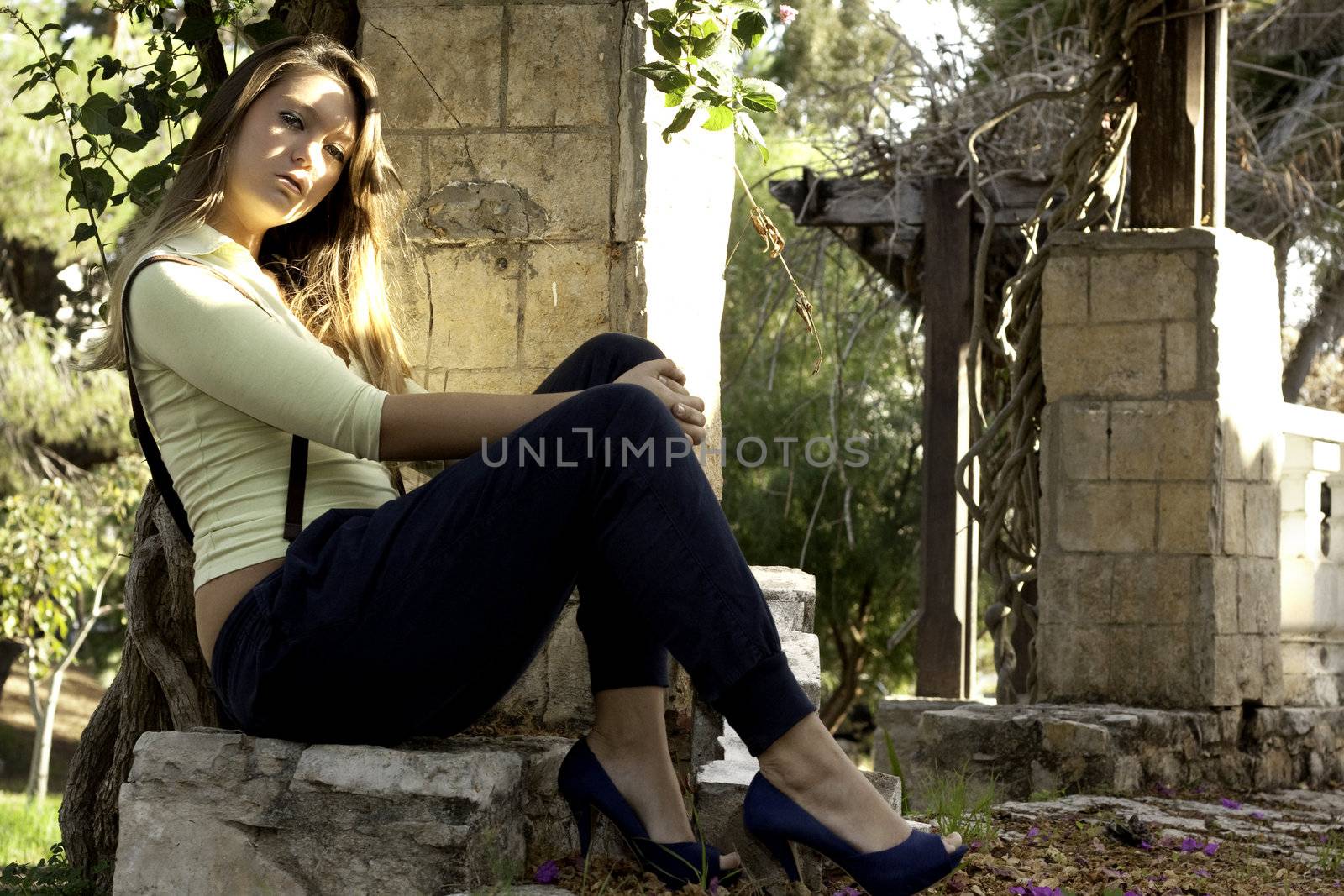 View of a beautiful blond woman posing on a fashionable way.