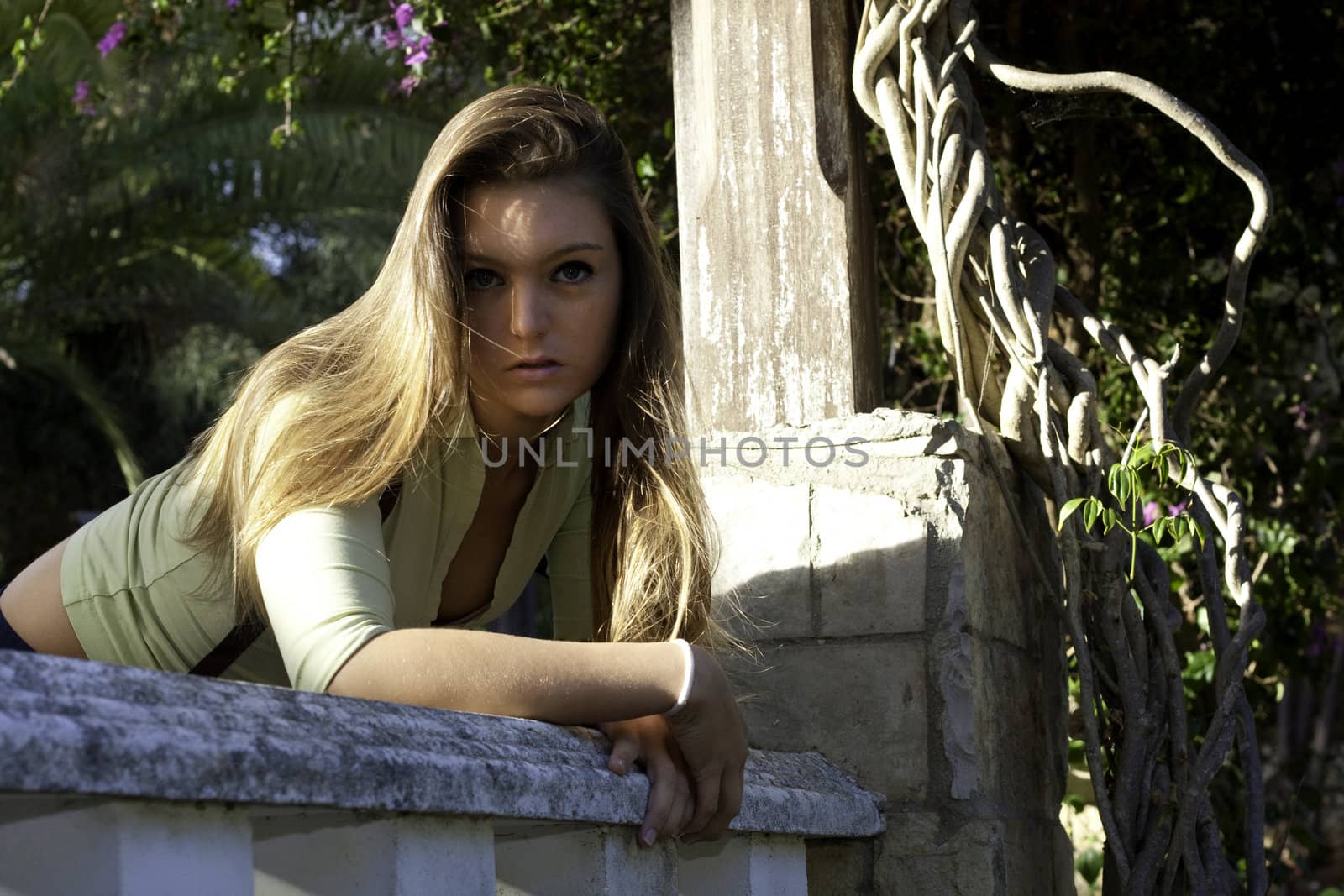 View of a beautiful blond woman posing on a fashionable way.