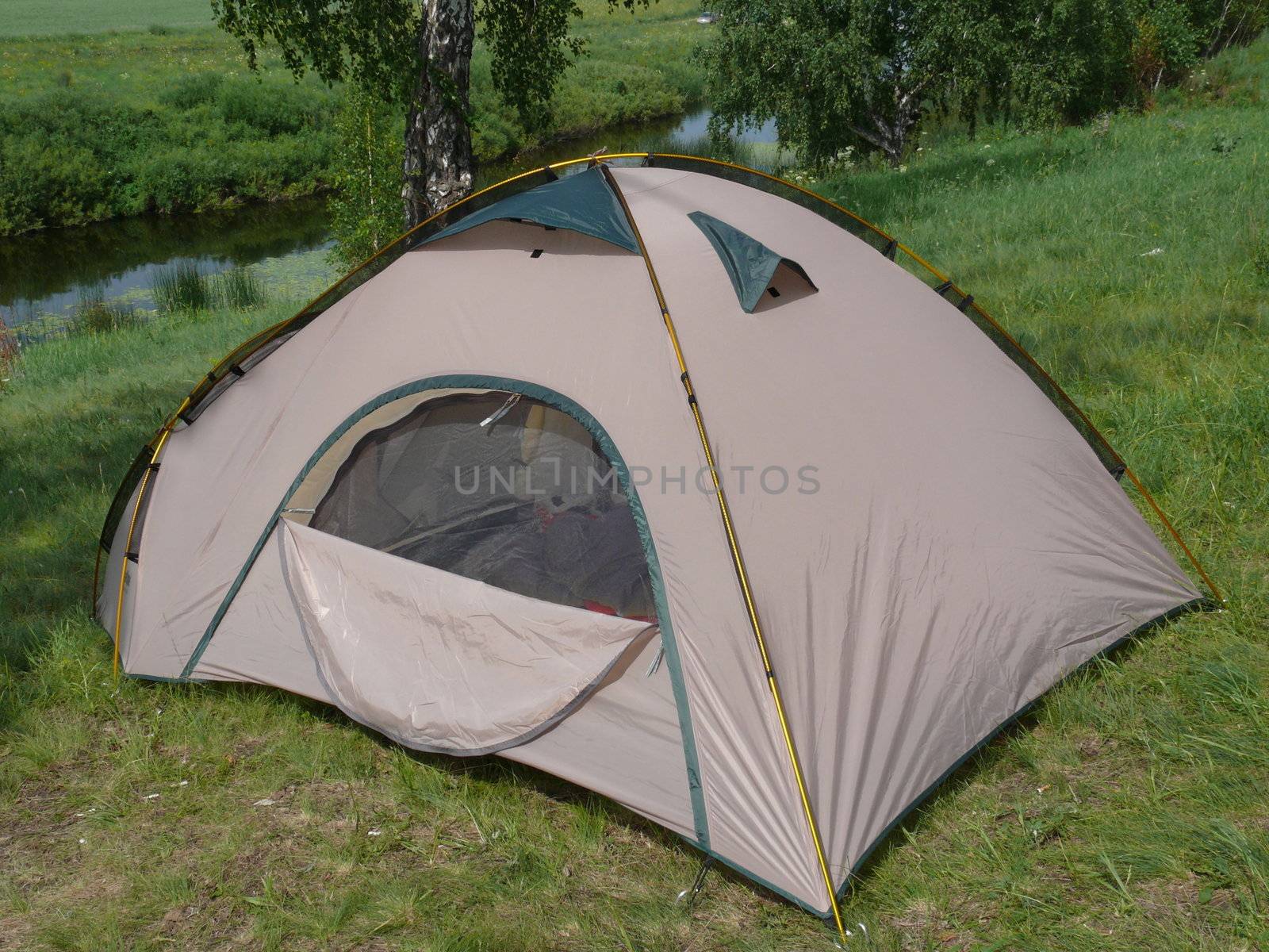 Tourist tent in a river background