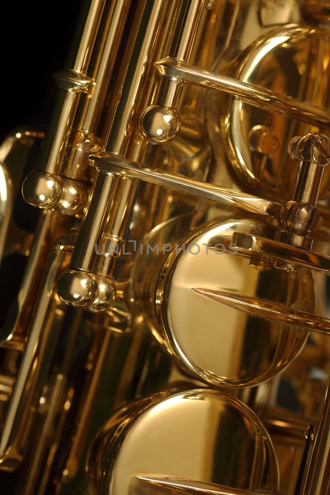 Macro image of the valves and keys of a saxophone.
