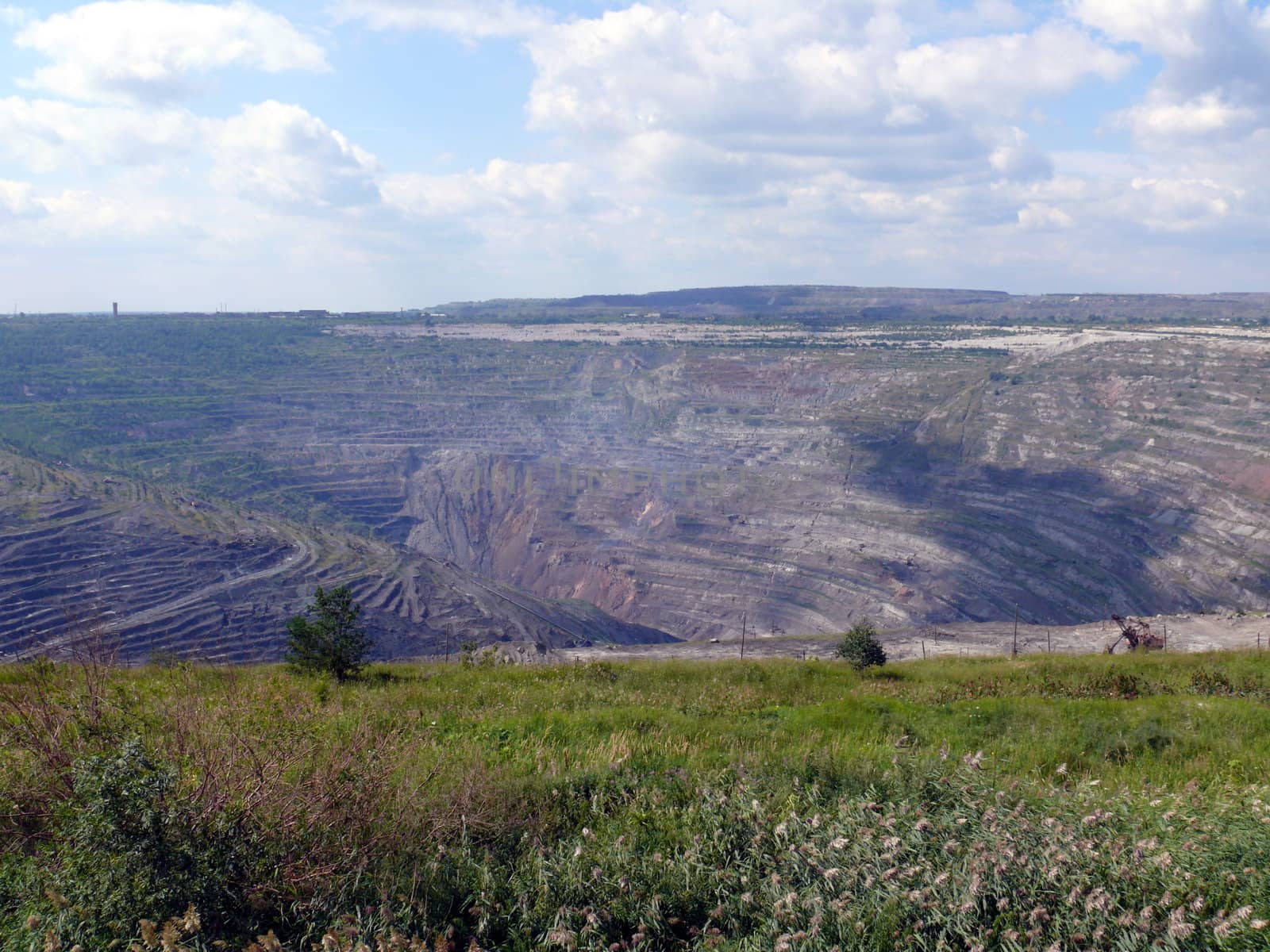 Open coal mine in town Korkino - Russia by Stoyanov
