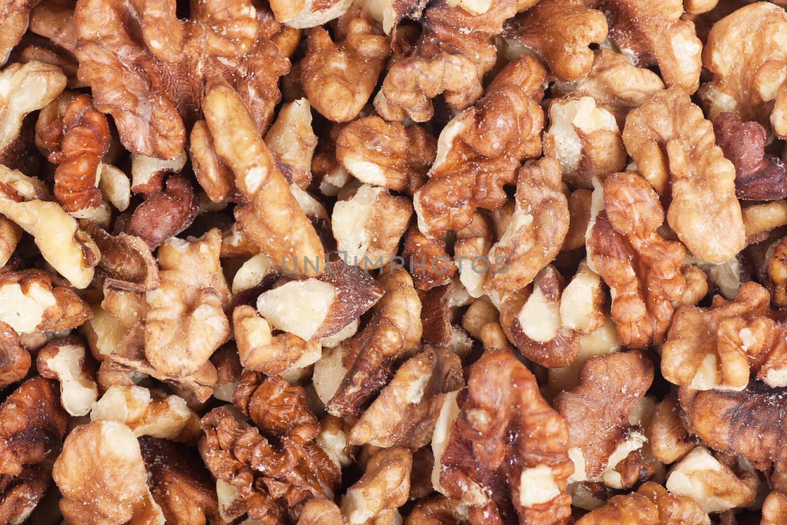 Closeup view of peeled walnuts. Nature background.