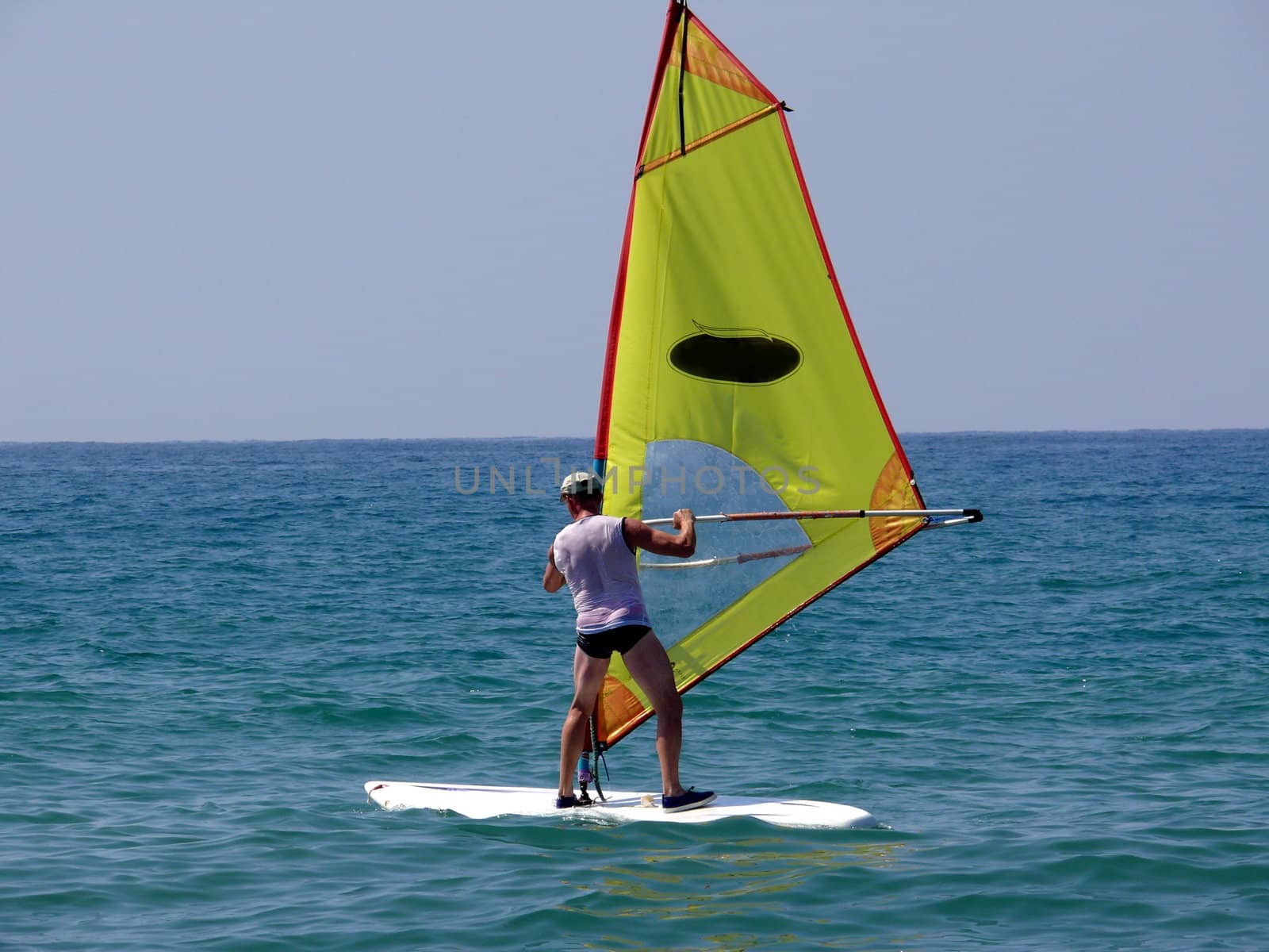 Windsurfer in the sea by Stoyanov