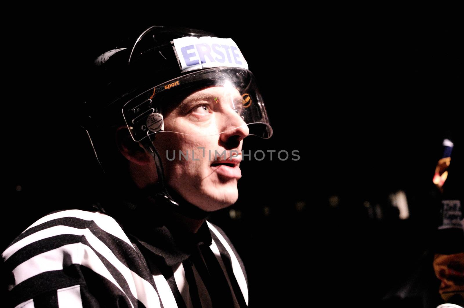 ZELL AM SEE, AUSTRIA - FEB 1: Austrian National League. Referee Roland Altersberger during light out break. Game EK Zell am See vs. ATSE Graz (Result 4-1) on February 1, 2011, at hockey rink of Zell am See