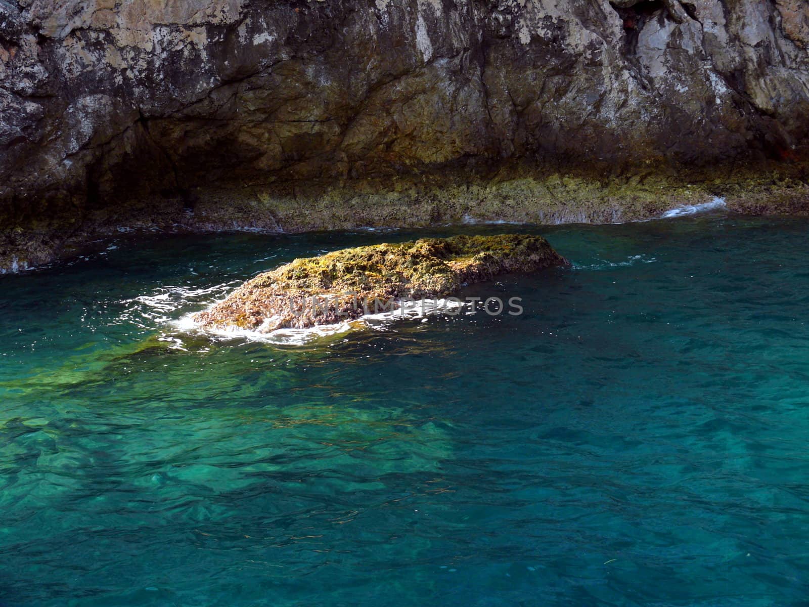 Stone in the clear sea by Stoyanov