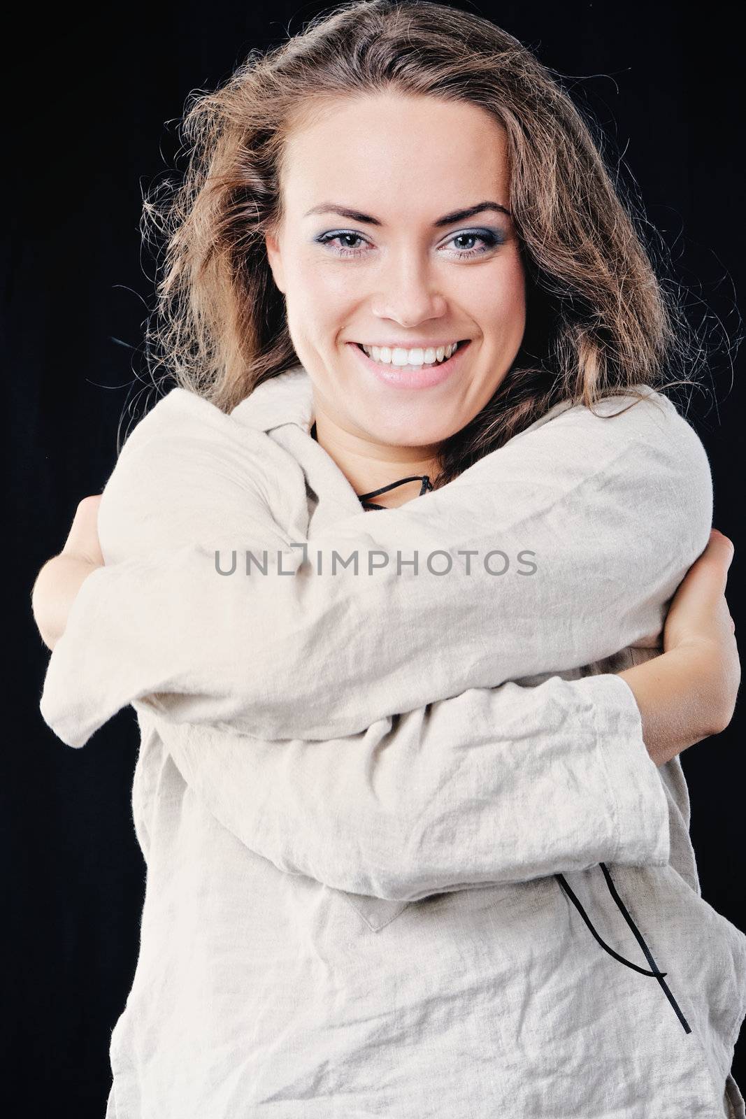 Happy cute young woman. Isolated on black background.