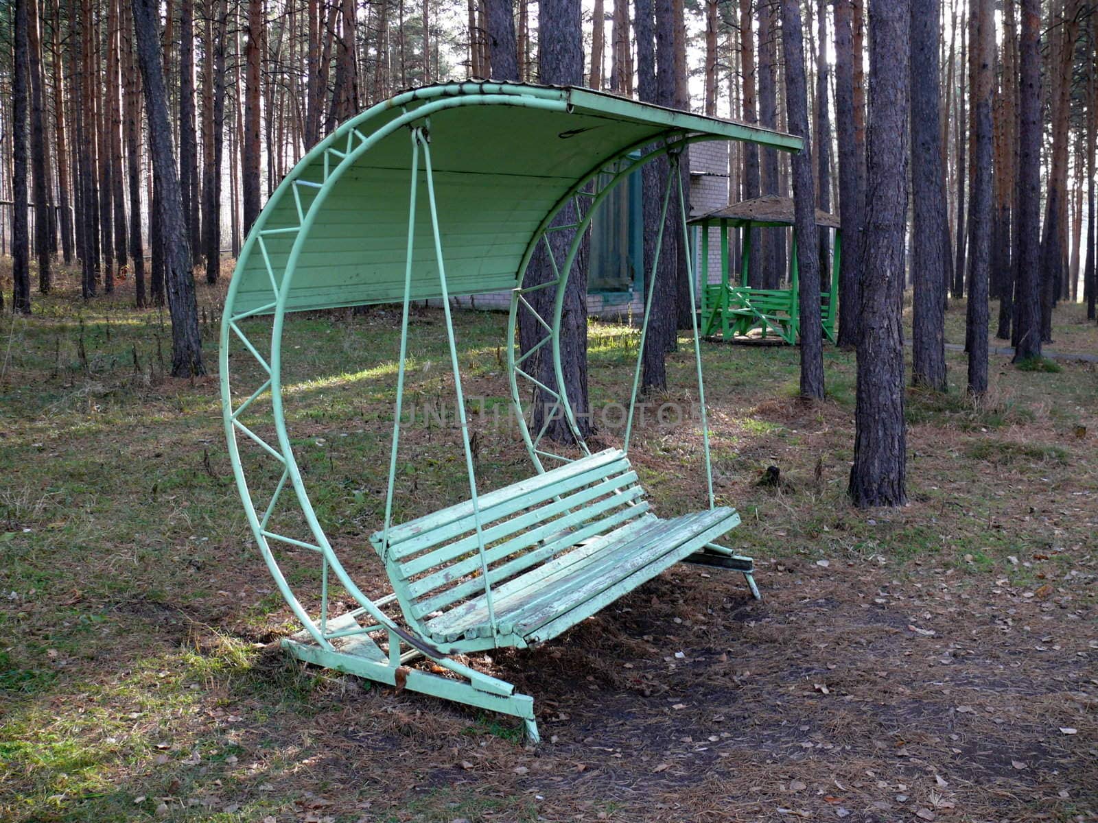 Old swing in playground by Stoyanov