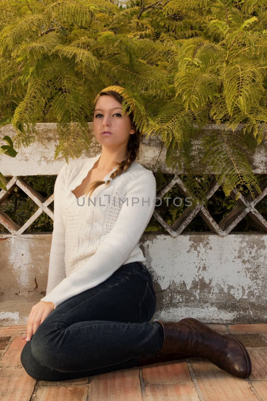 View of a beautiful blond woman posing on a fashionable way.