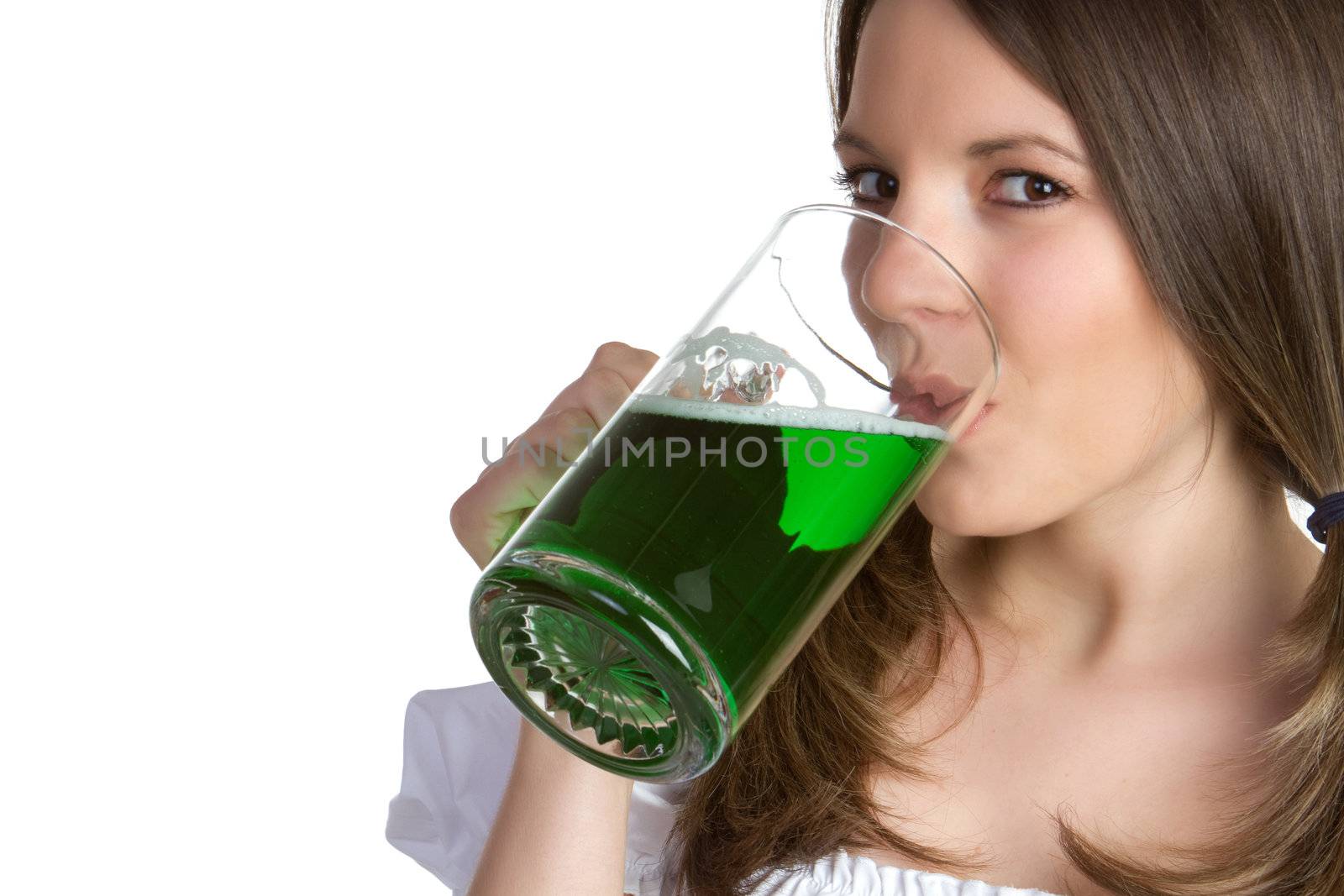 Beautiful woman drinking green beer