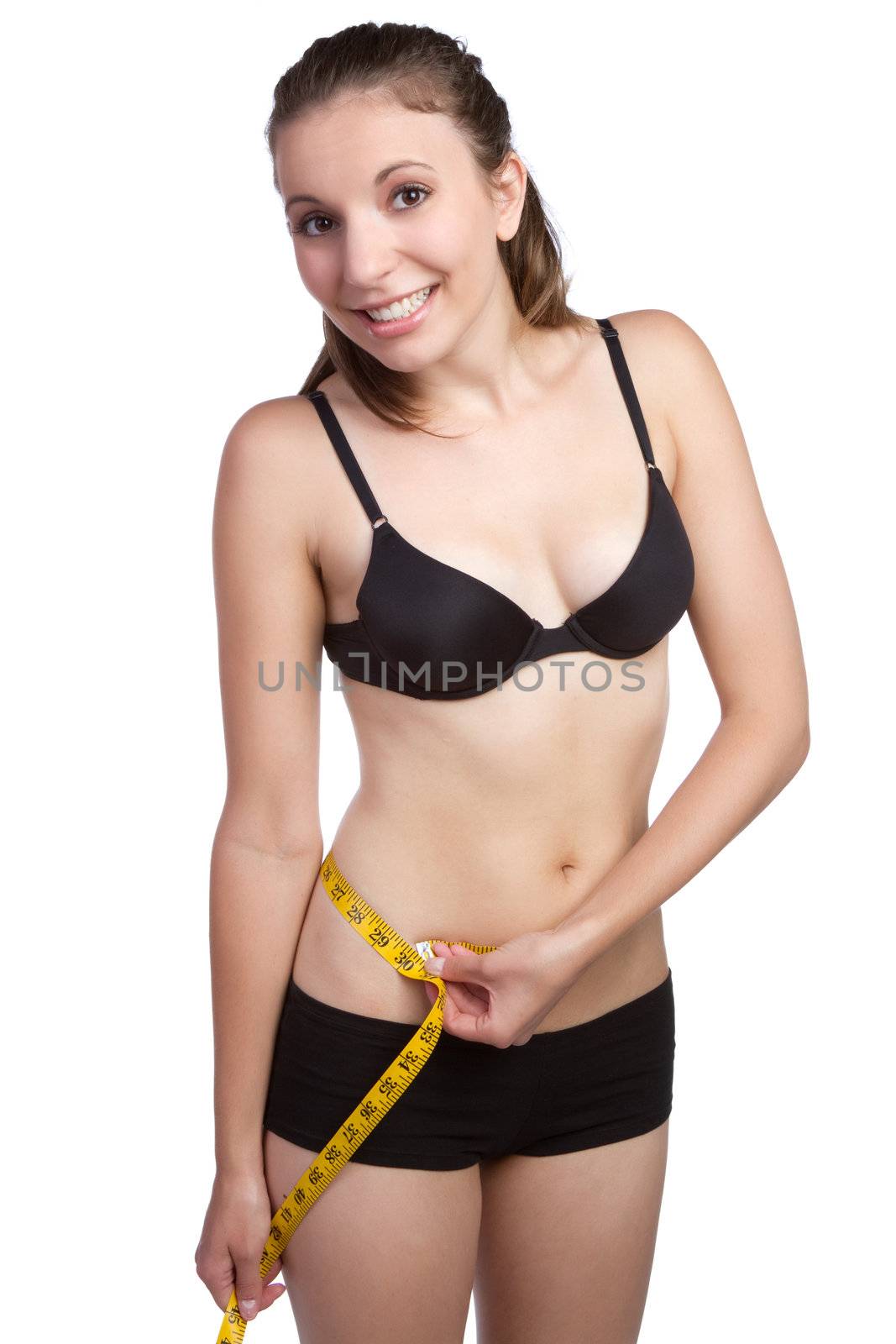 Beautiful isolated woman measuring waist