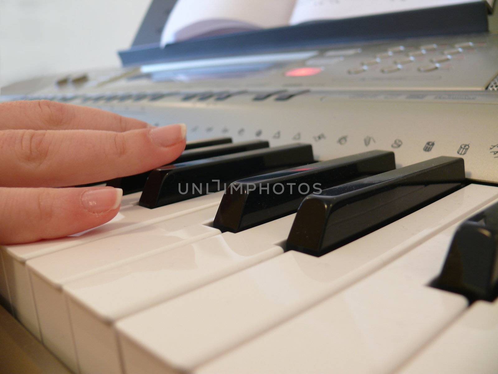 Hand with piano keyboard