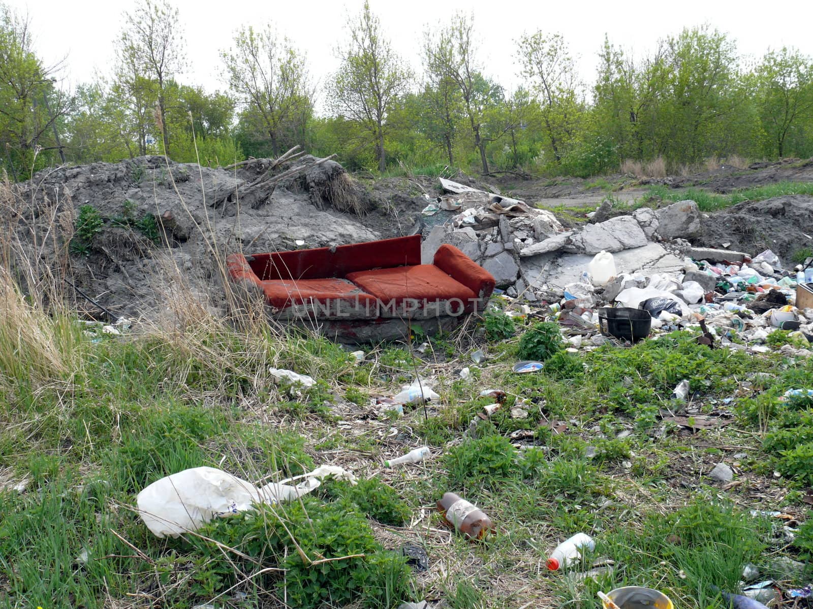 Old red sofa in the dump by Stoyanov