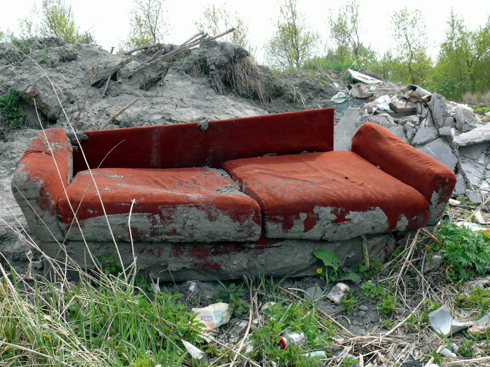 Old red sofa in the dump by Stoyanov