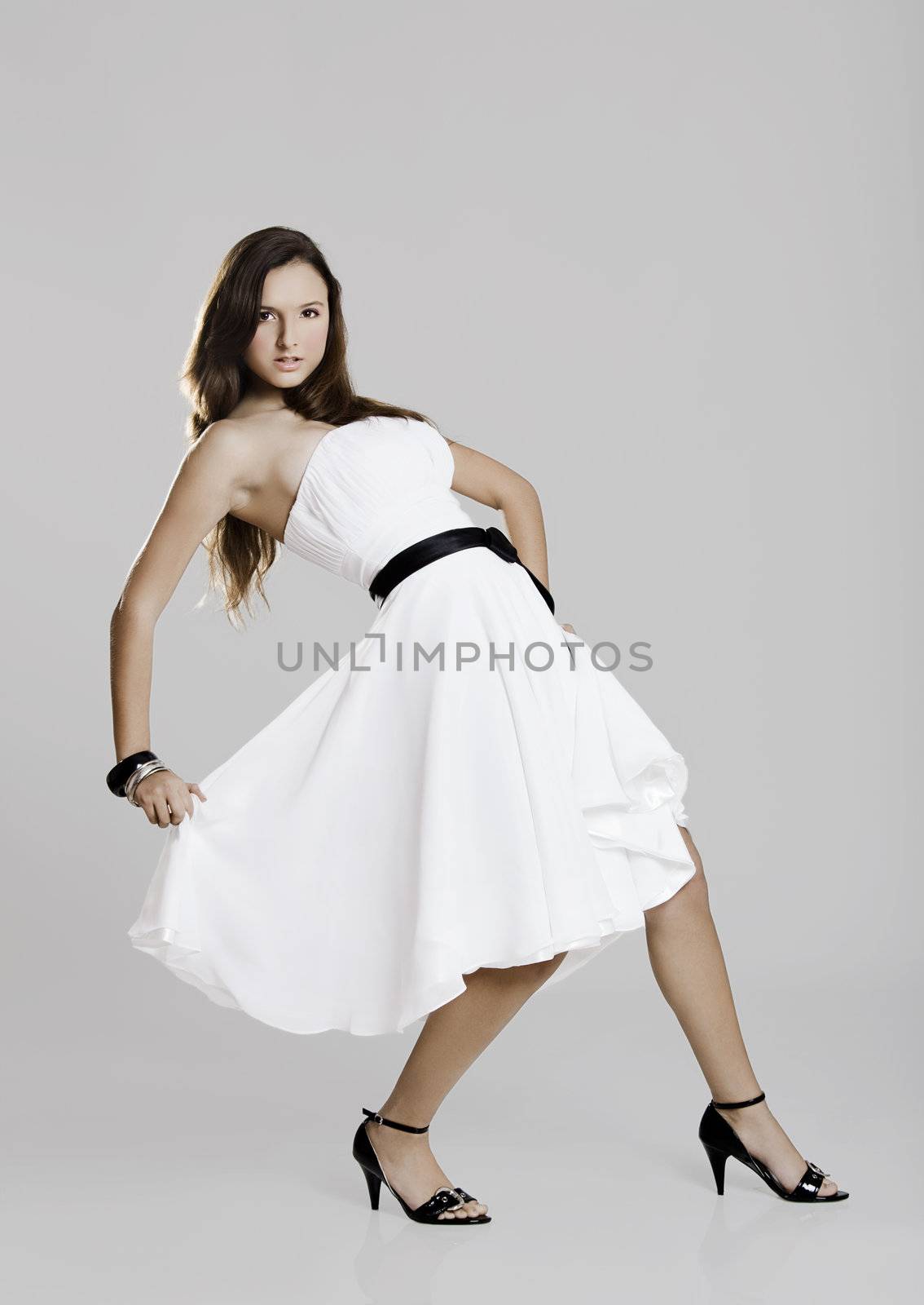 Beautiful and sexy woman wearing a wonderful white dress