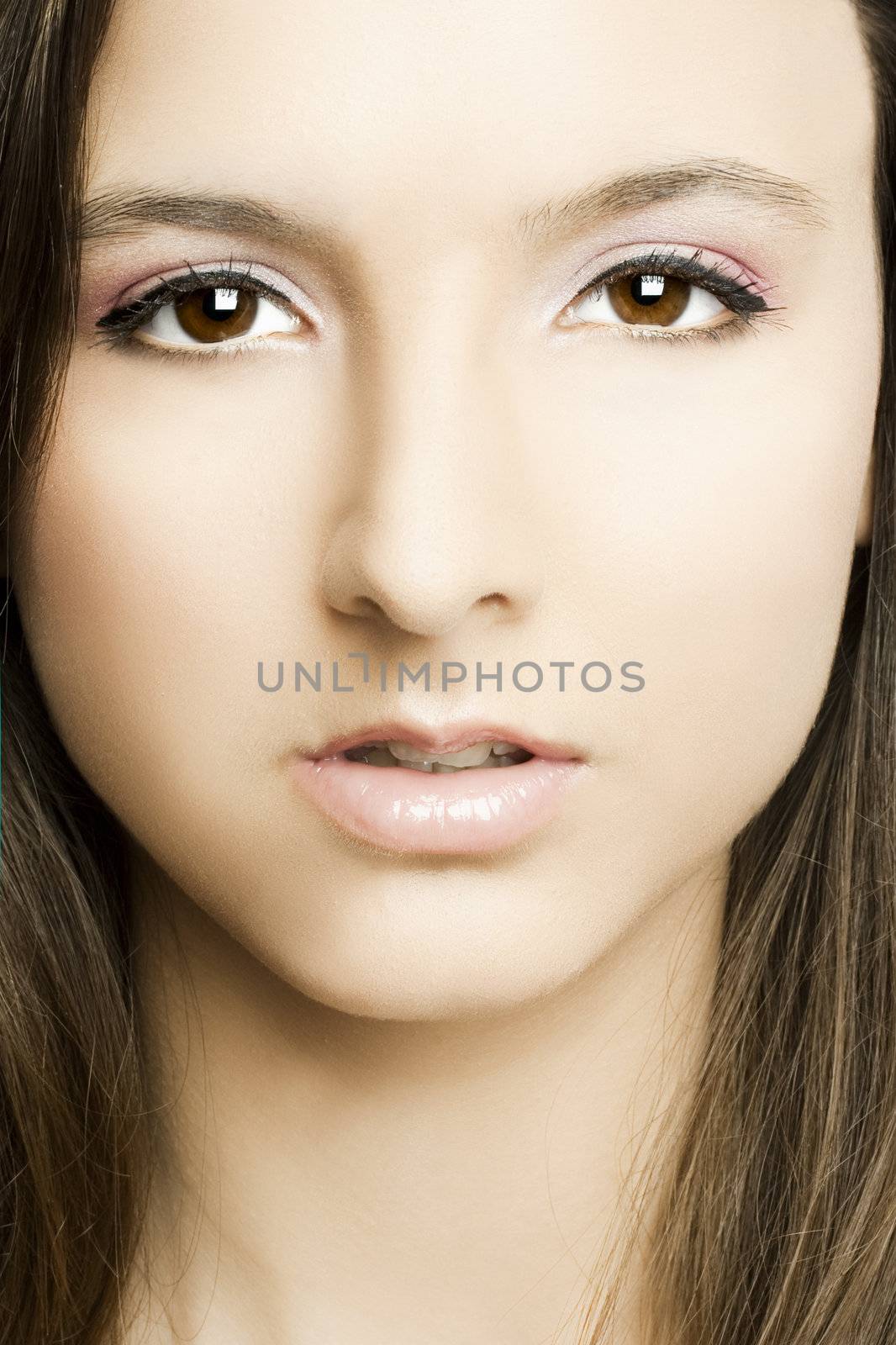 Close-up of beautiful woman face with perfect makeup 