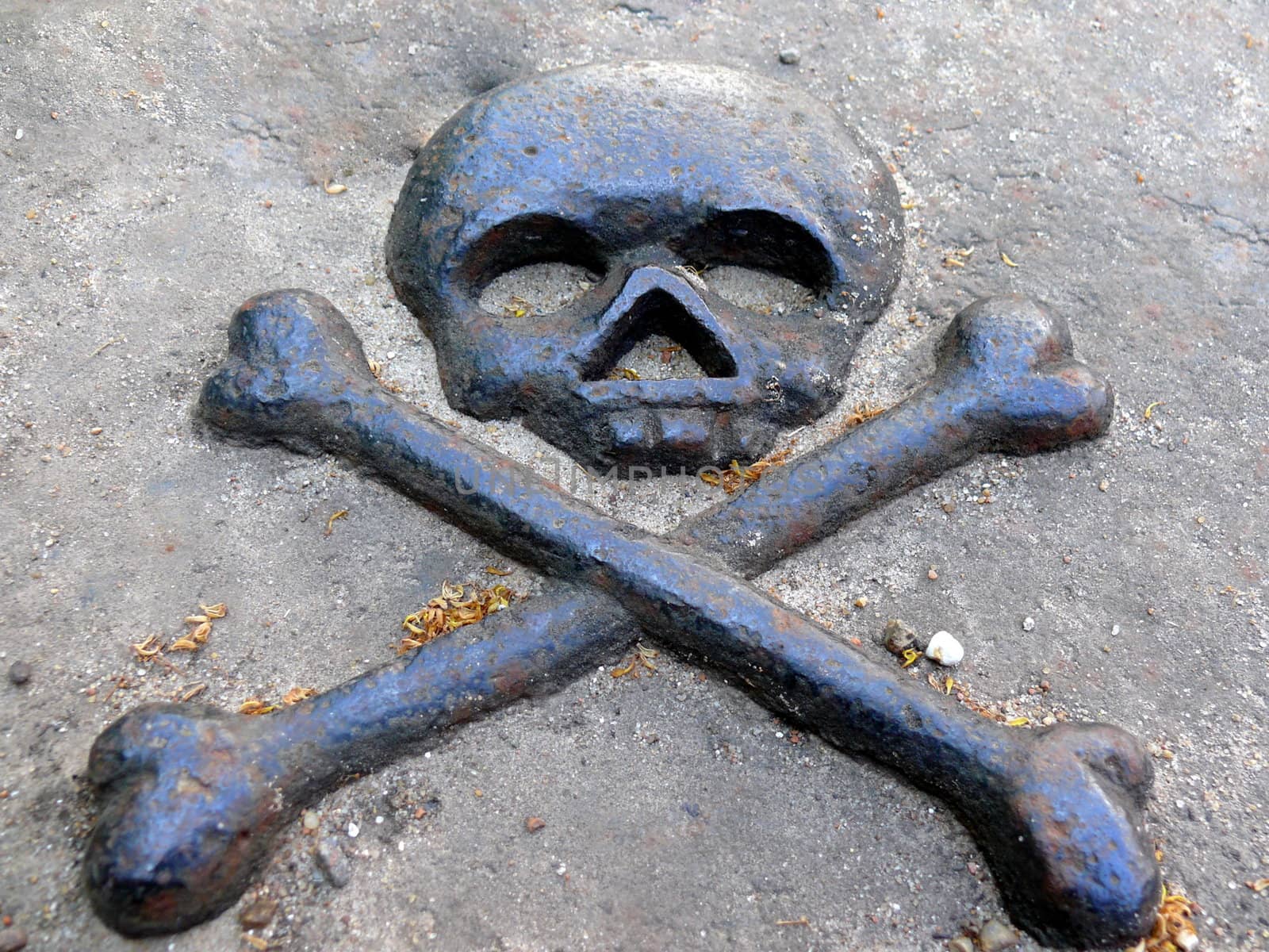 Bronze symbol of death in gravestone by Stoyanov