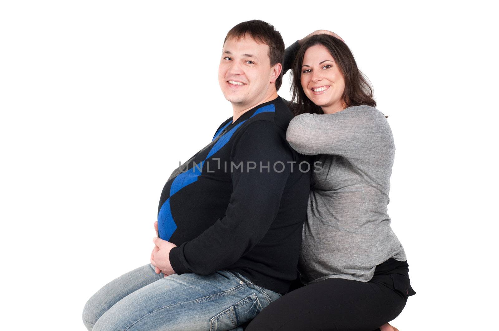 Shot of beautiful couple, pregnant woman isolated on white