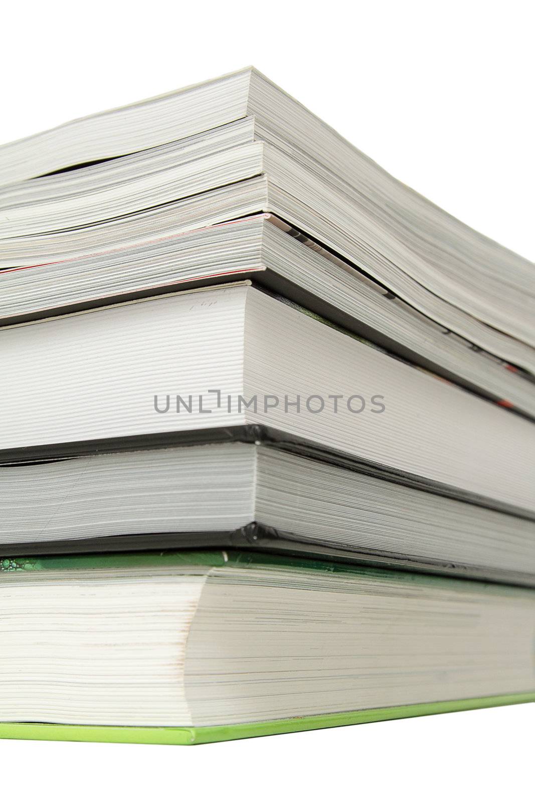 Stack of several books over white background