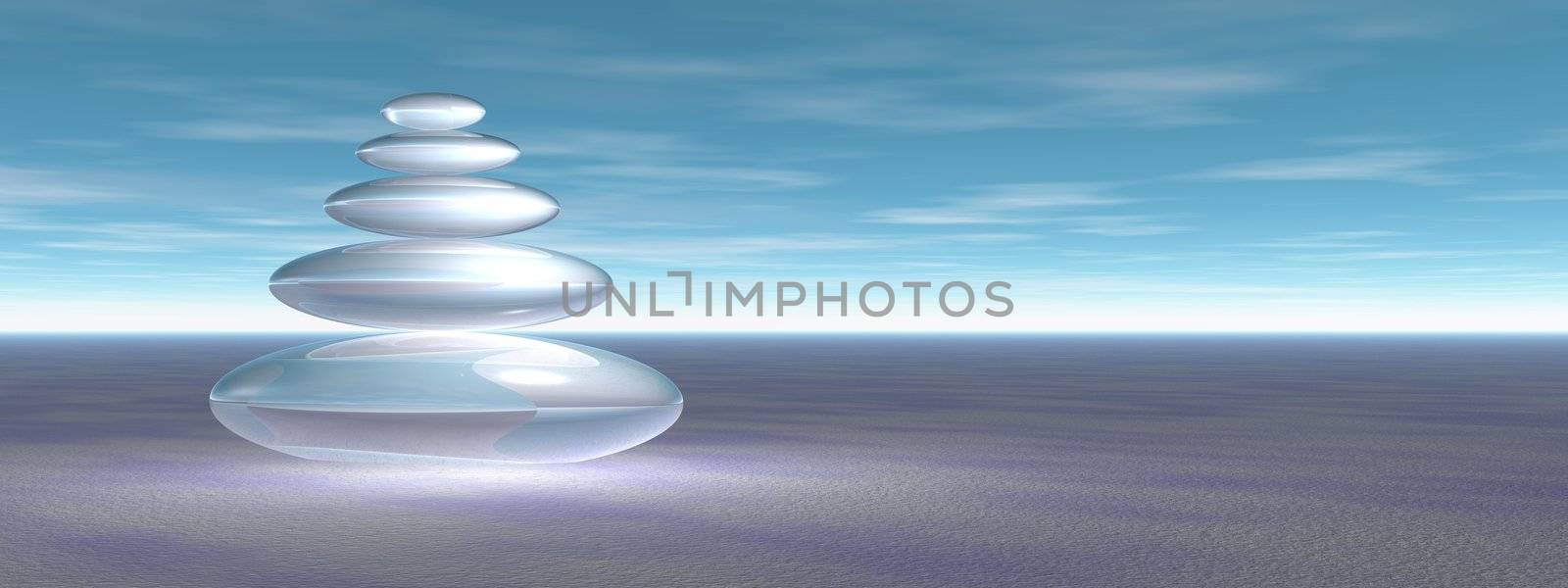 Balanced white stones upon flat snow ground in a blue sky background