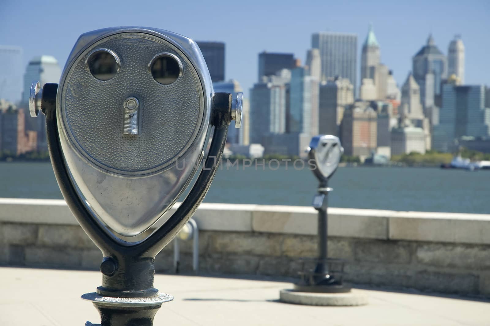 binoculars on ellis island, defocused  manhattan in background