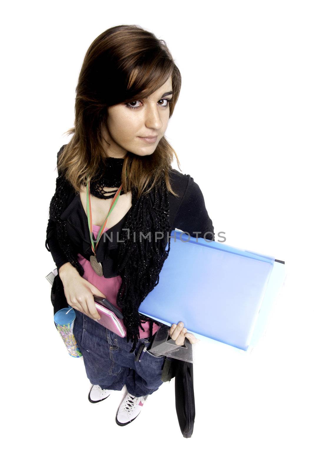 View of a teenager school girl holding books on a white background.