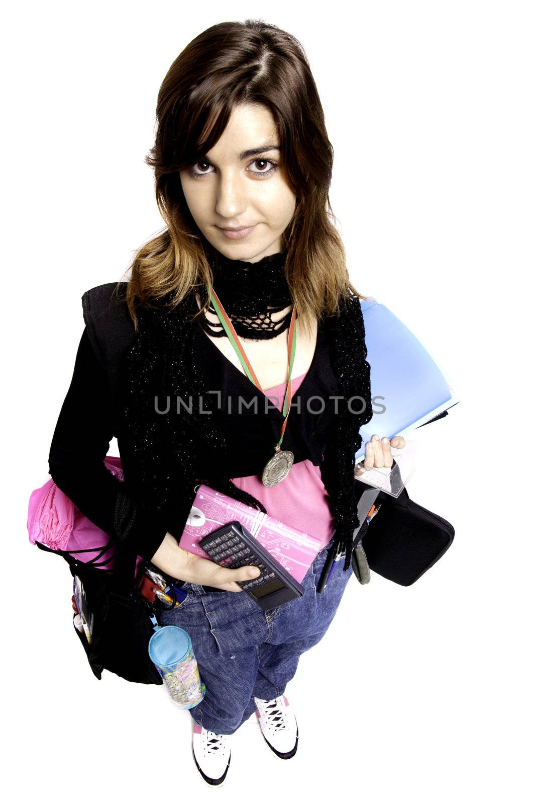 View of a teenager school girl holding books on a white background.
