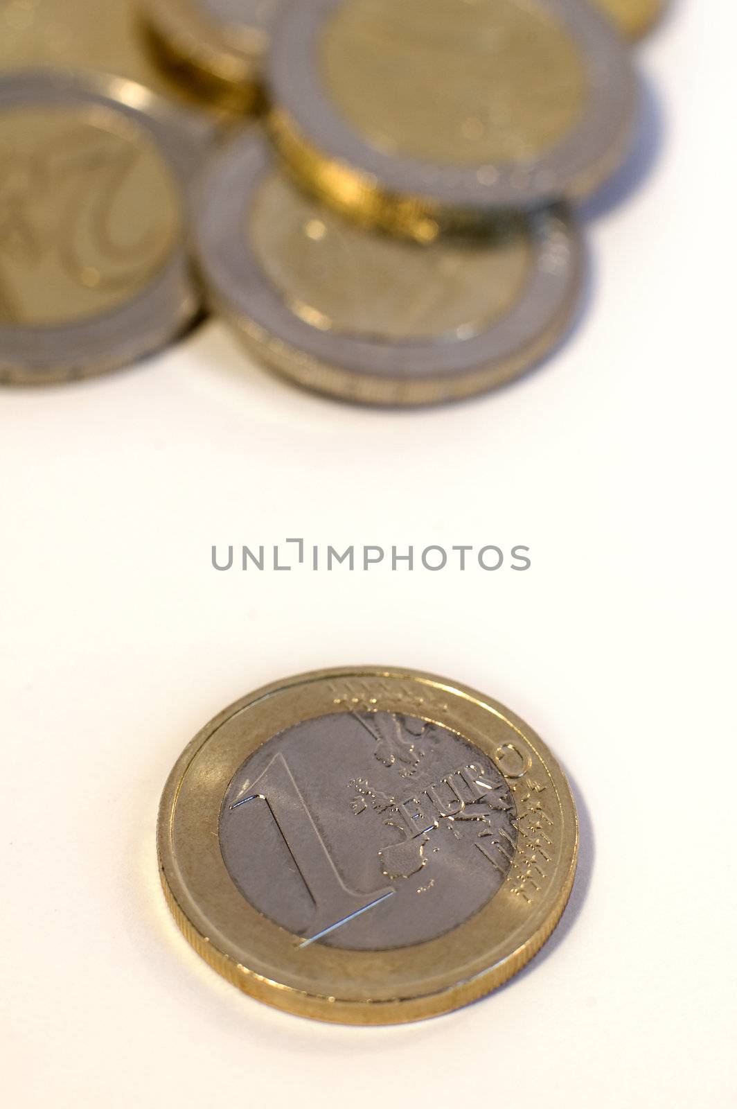 several euro coins isolated on white background, shallow depth of view