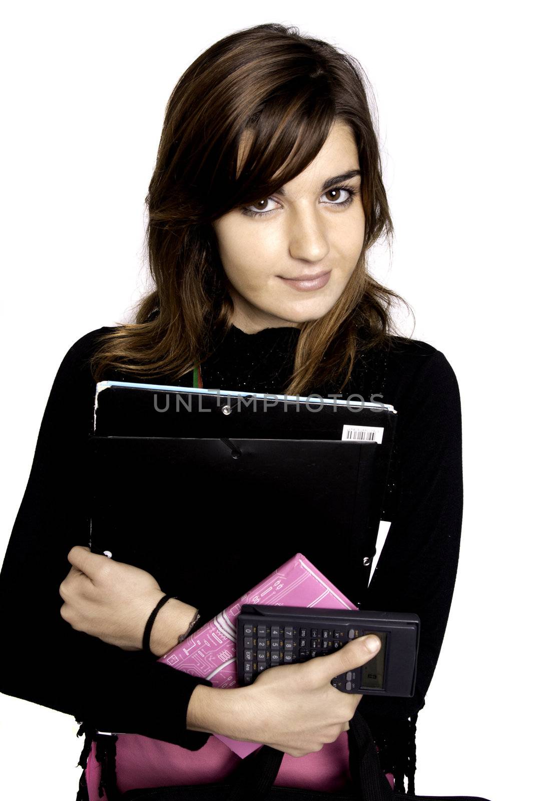 View of a teenager school girl holding books on a white background.