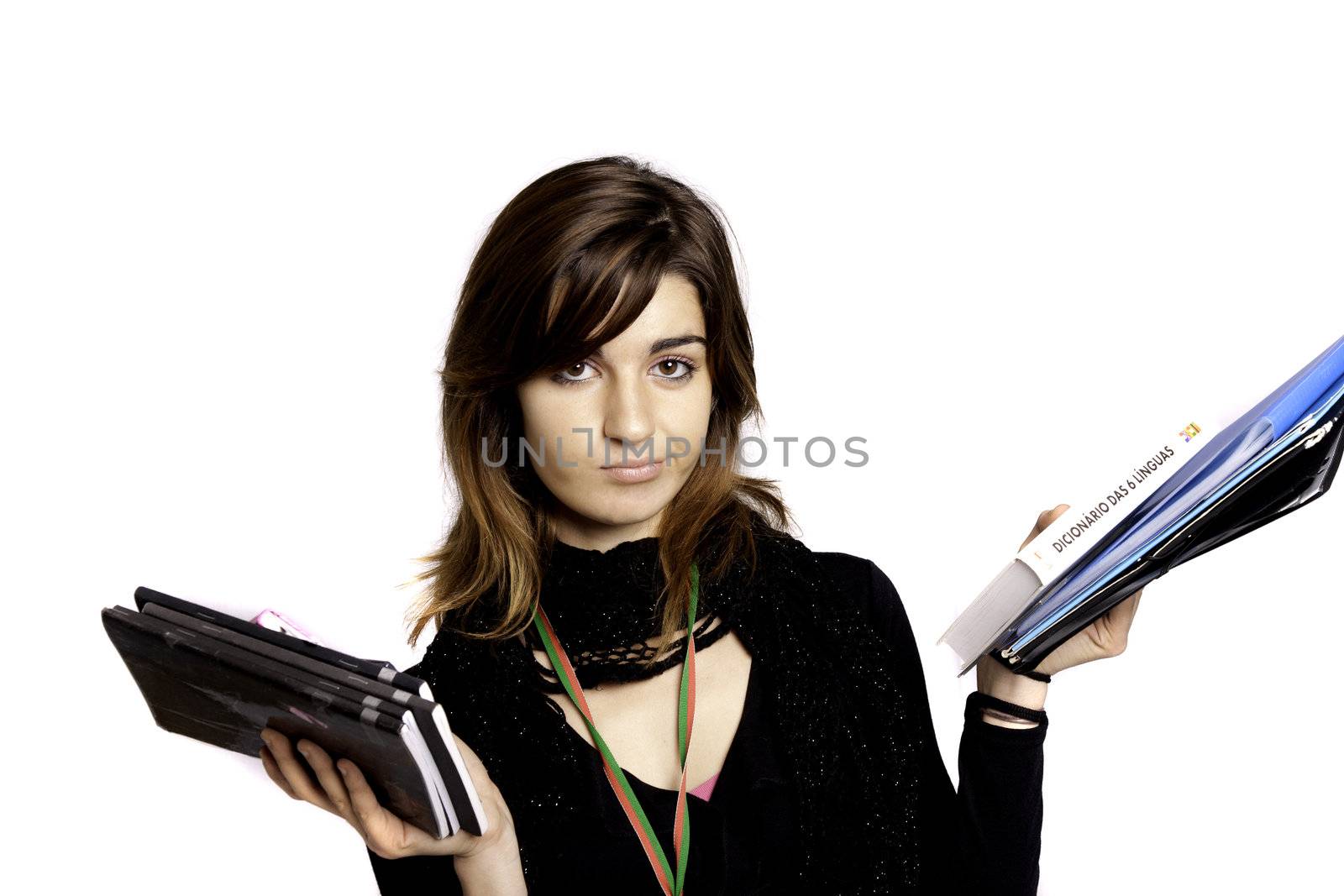 View of a teenager school girl holding books on a white background.