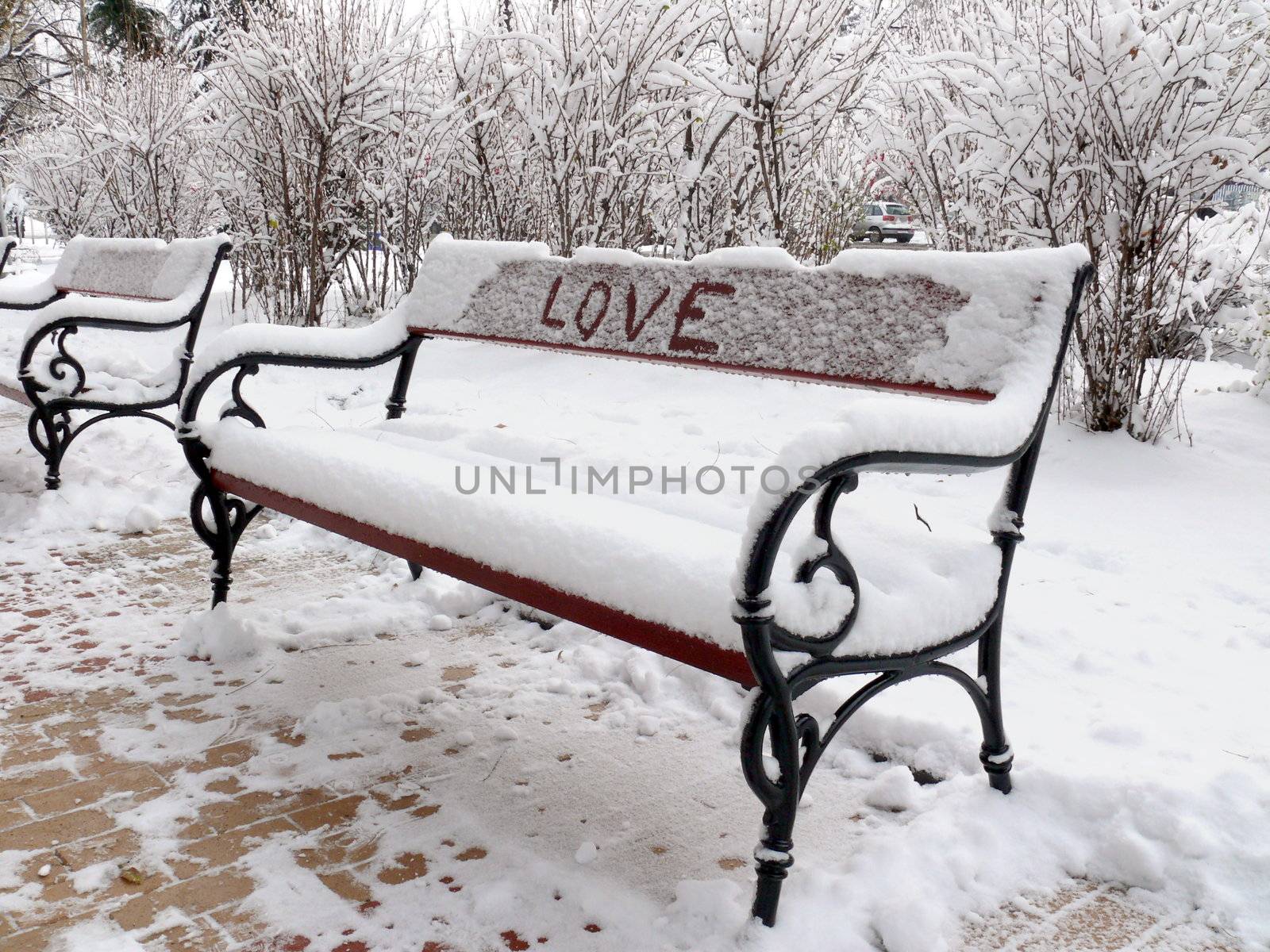 Bench of love with snow in Sofia, Bulgaria by Stoyanov