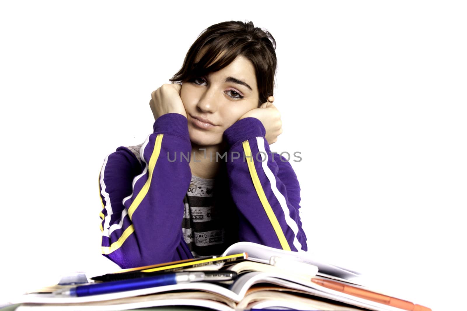 View of a teenager school girl looking at the camera with an upset expression.