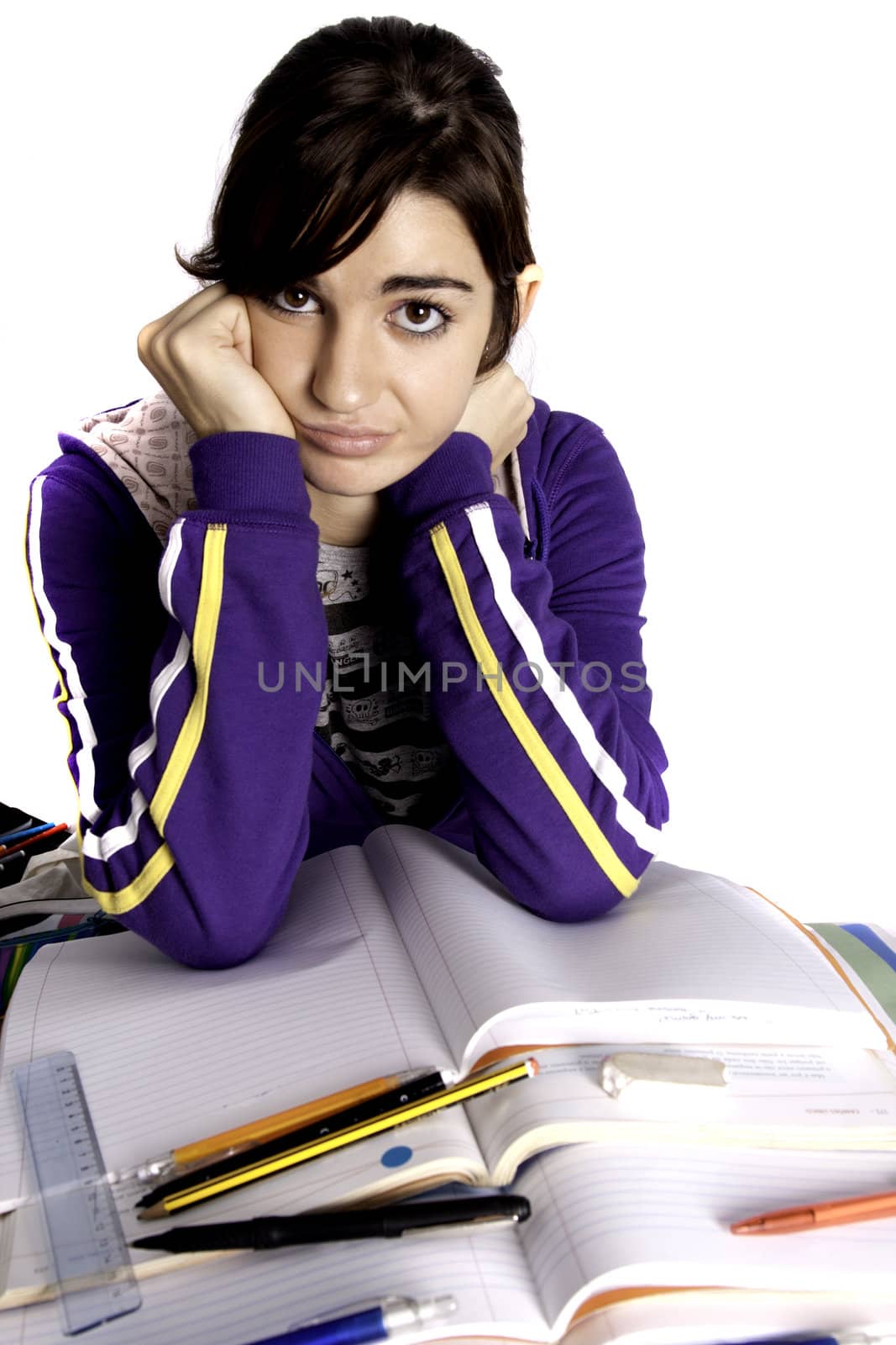 View of a teenager school girl looking at the camera with an upset expression.