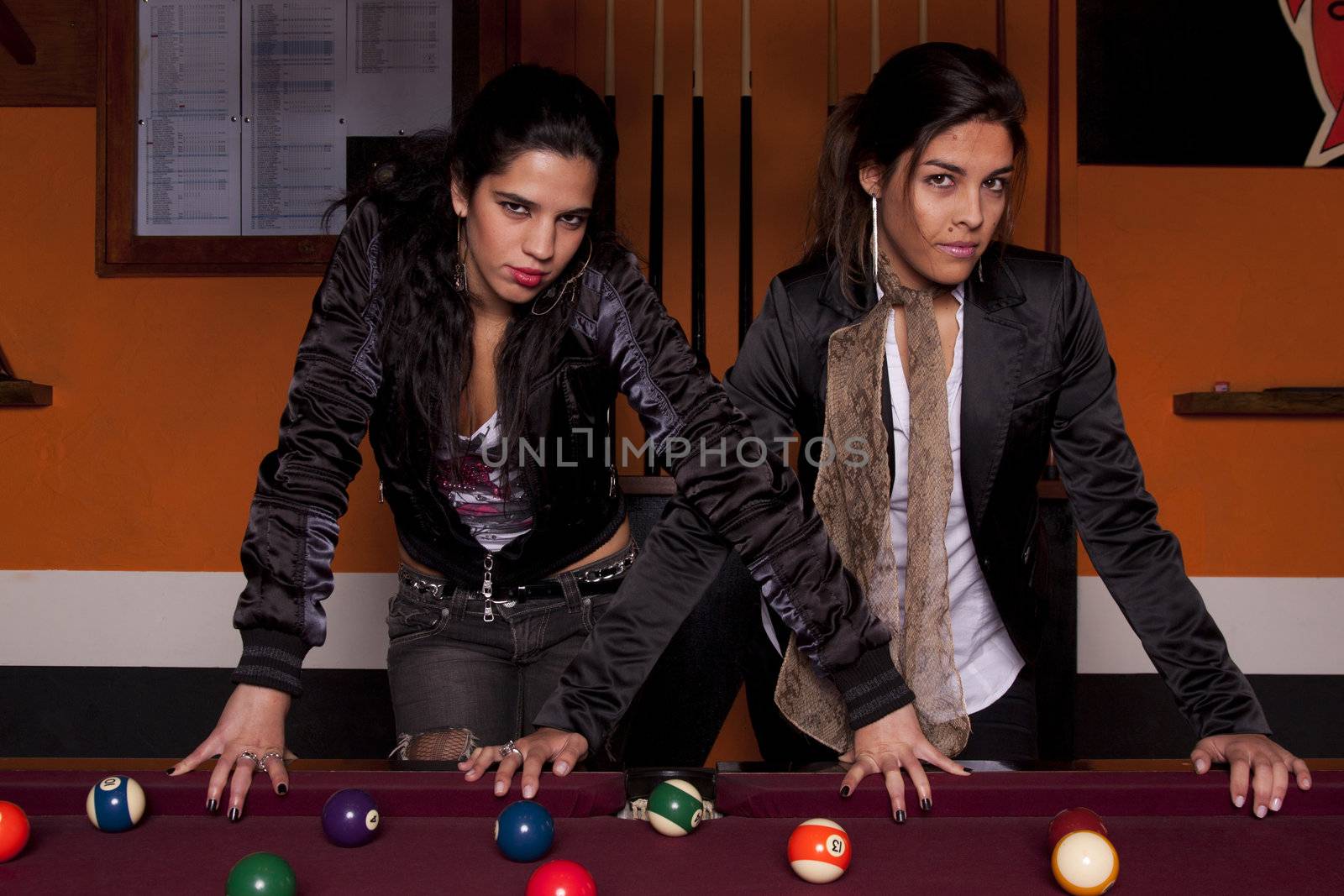 two girls next to a snooker table by membio