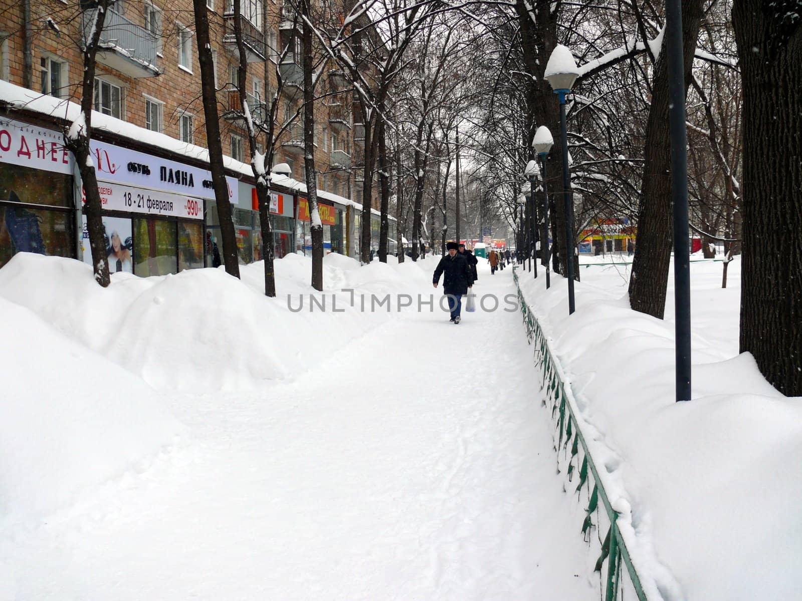 Snowdrifts in the streets after snowfall in Moscow by Stoyanov