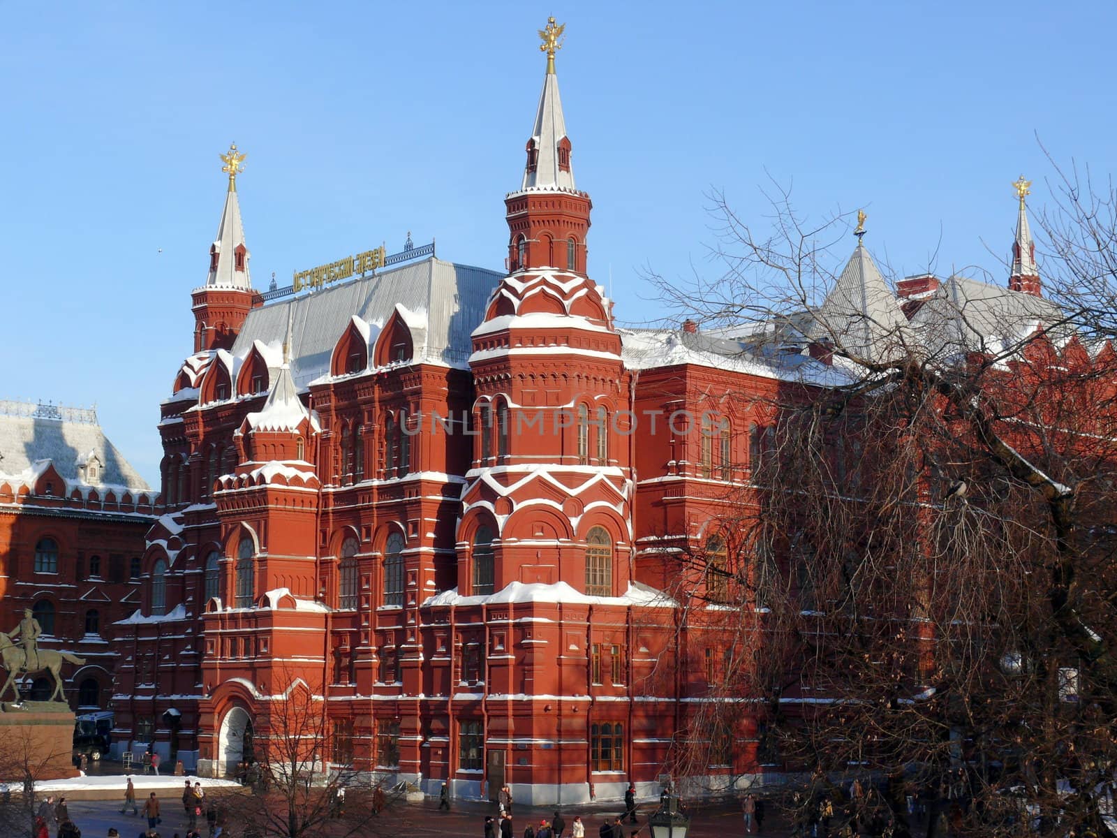 Moscow, Russia - February 23, 2010: Winter day. Peoples walks near national historic musium in Moscow, Russia