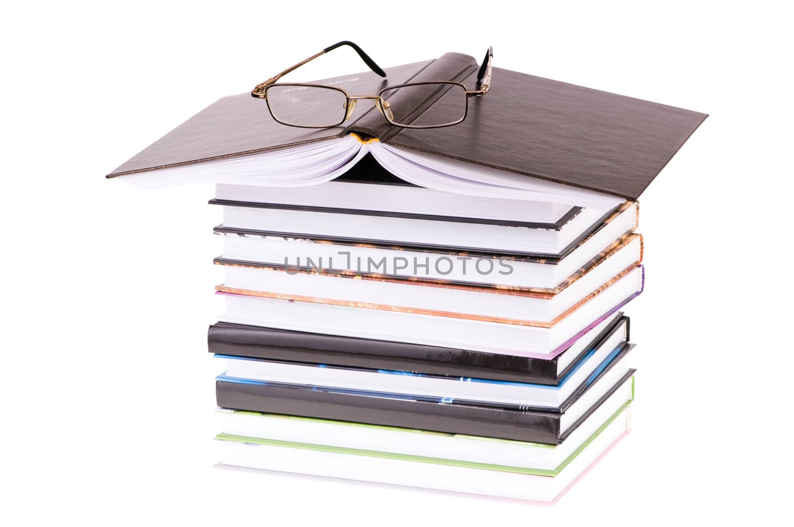 stack books with glasses isolated on white background