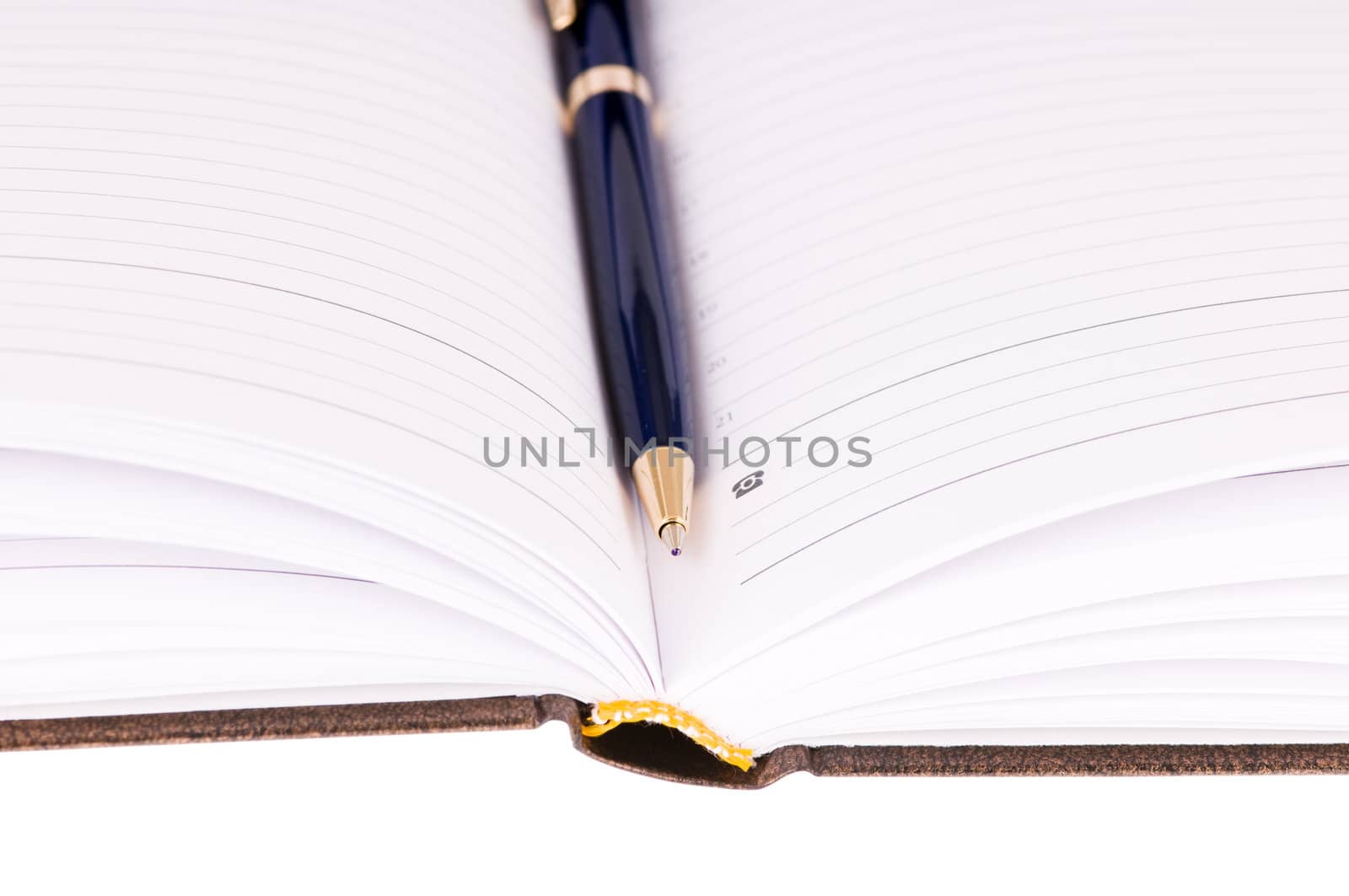 brown business diary with pen isolated on white background