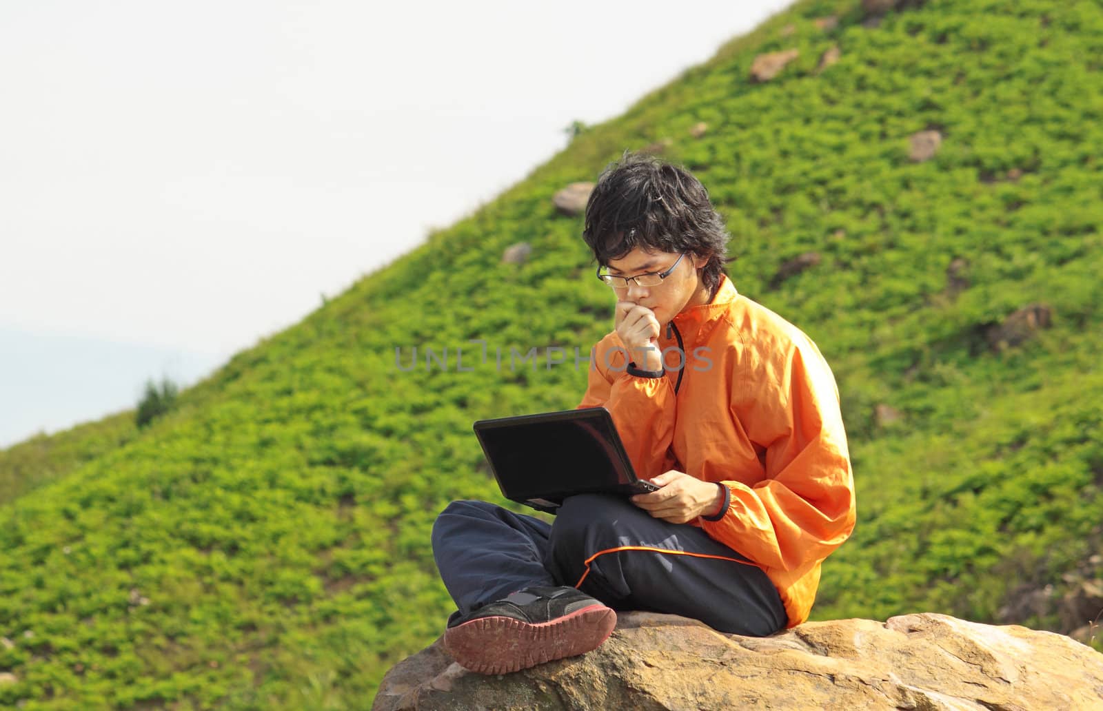 asain Man with notebook at day