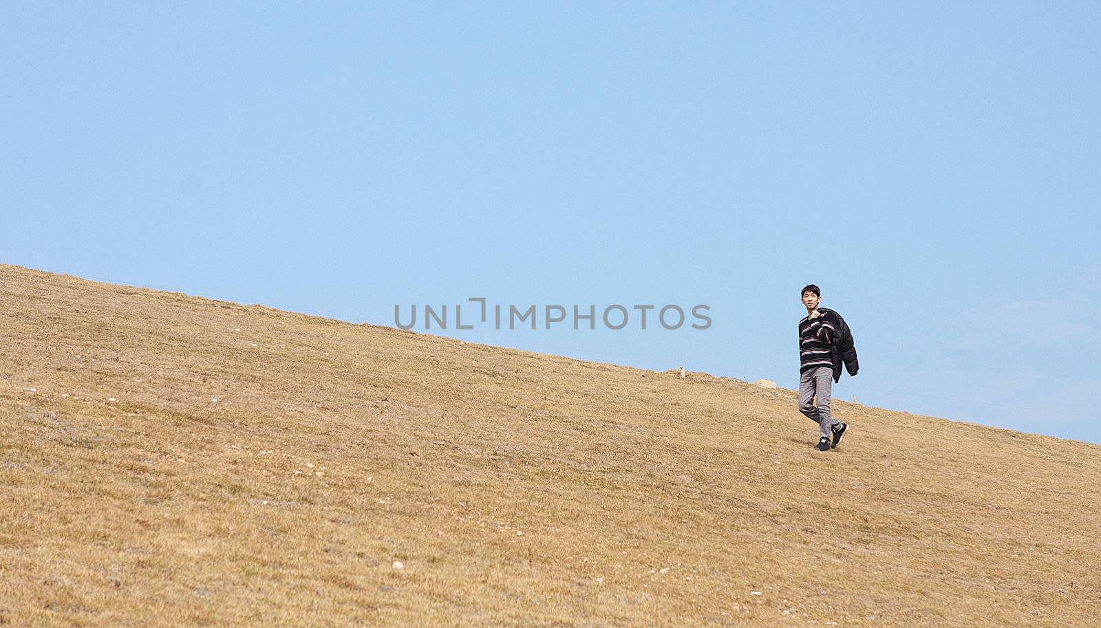 man walking on the mountain