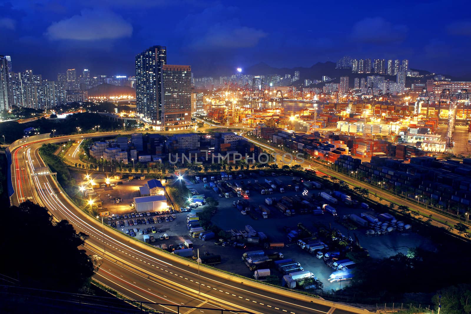 container terminal at night in hong kong