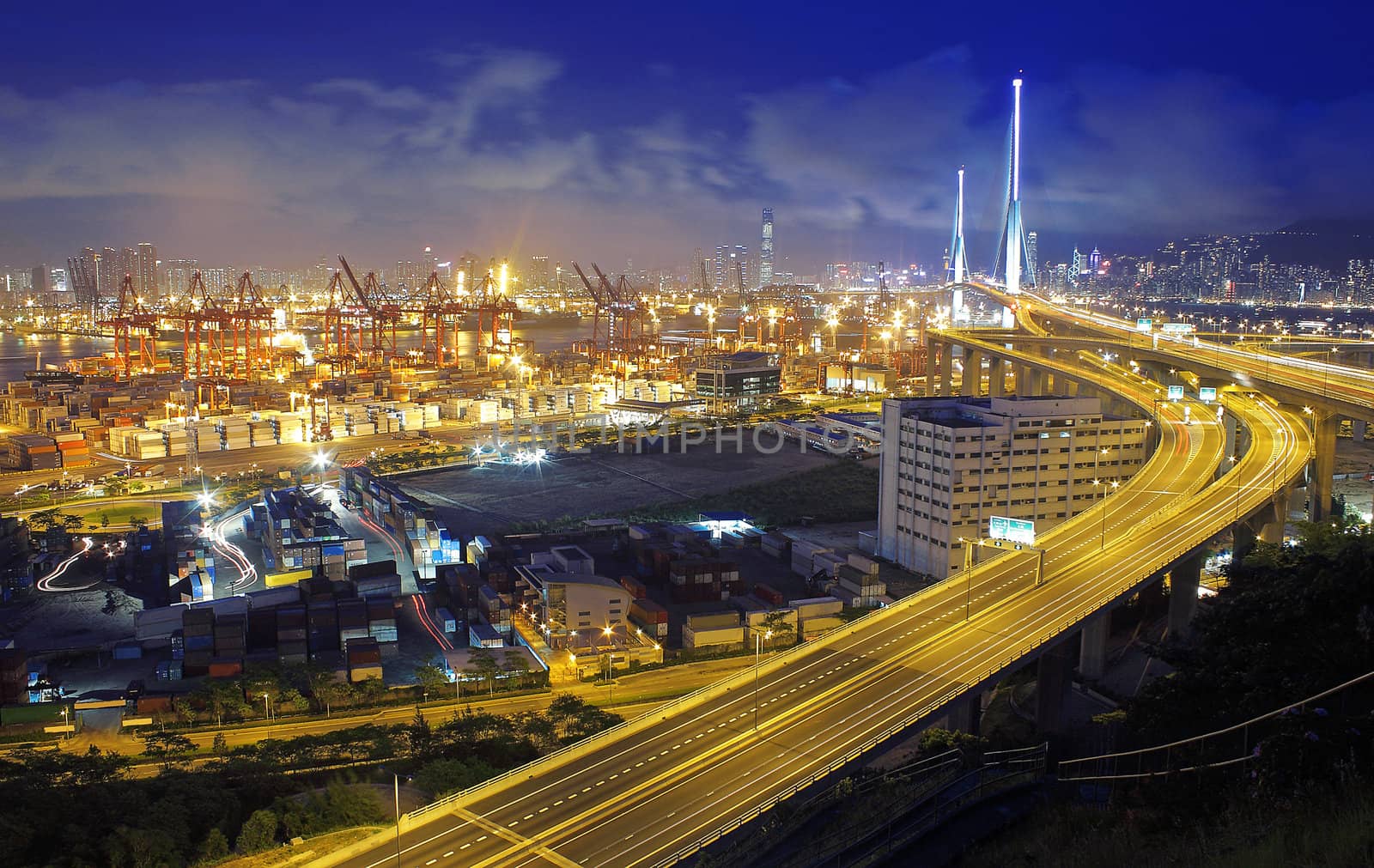 container terminal at night in hong kong