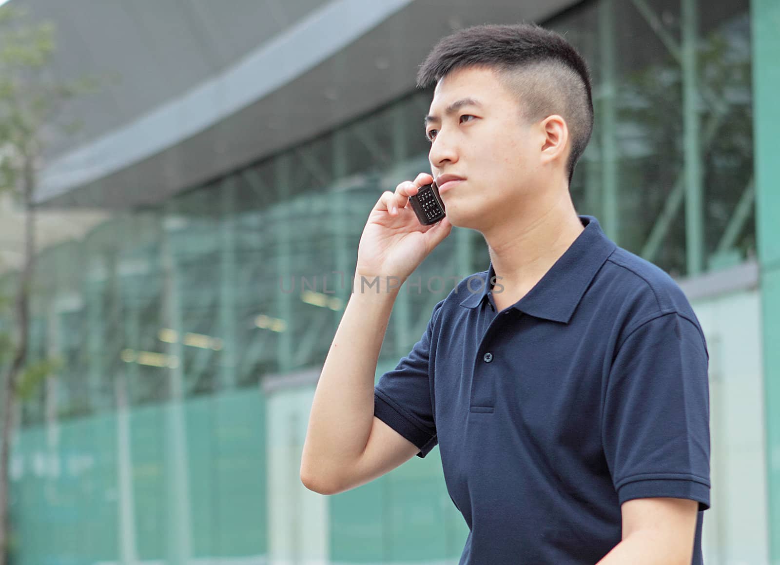 young man talking phone outdoor