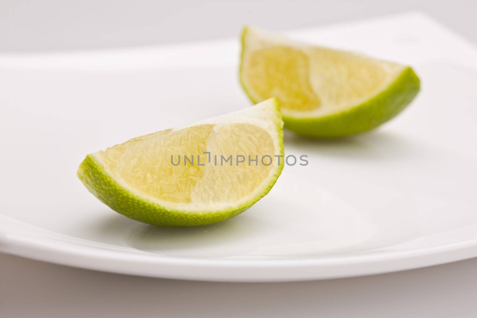 food series: tasty green sliced lime on plate