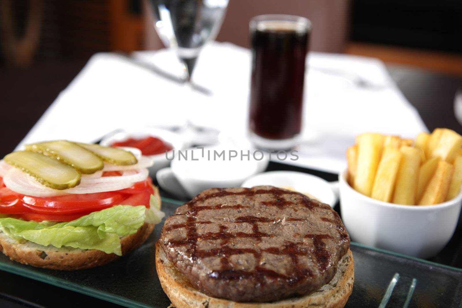 Open Burger with french fries sauces and cola